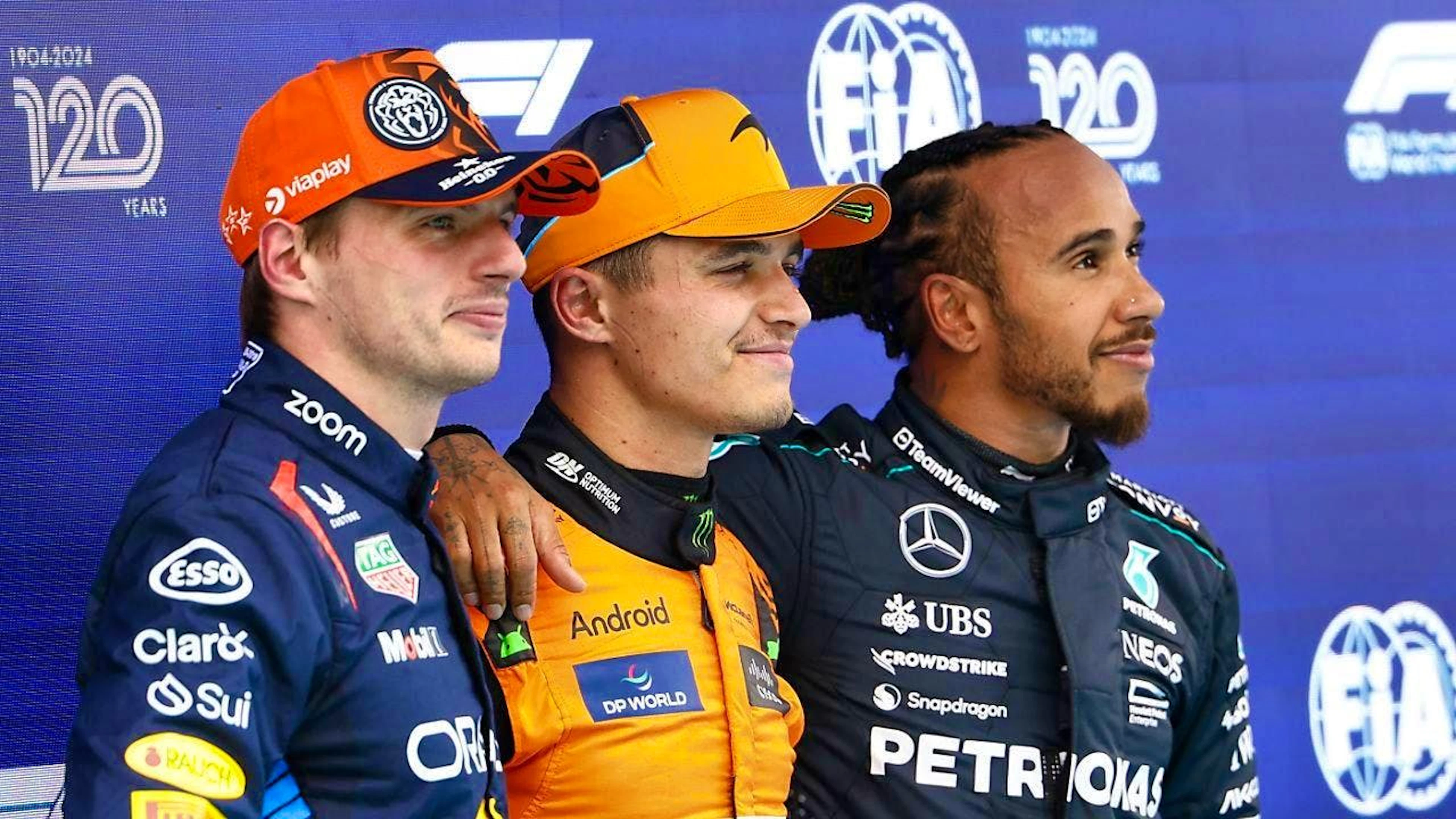 Pole man Lando Norris surrounded by the two multiple world champions Max Verstappen (left) and Lewis Hamilton (right)