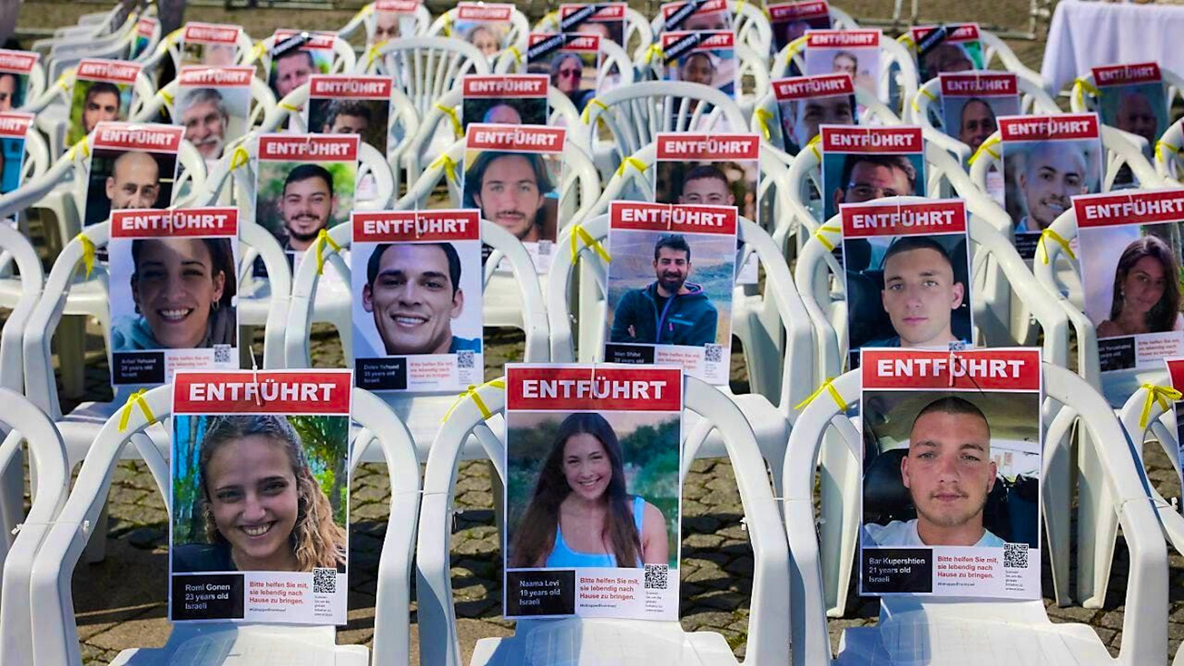 ARCHIVE - Chairs with photos of the Hamas hostages stand on Bebelplatz. Photo: Jörg Carstensen/dpa