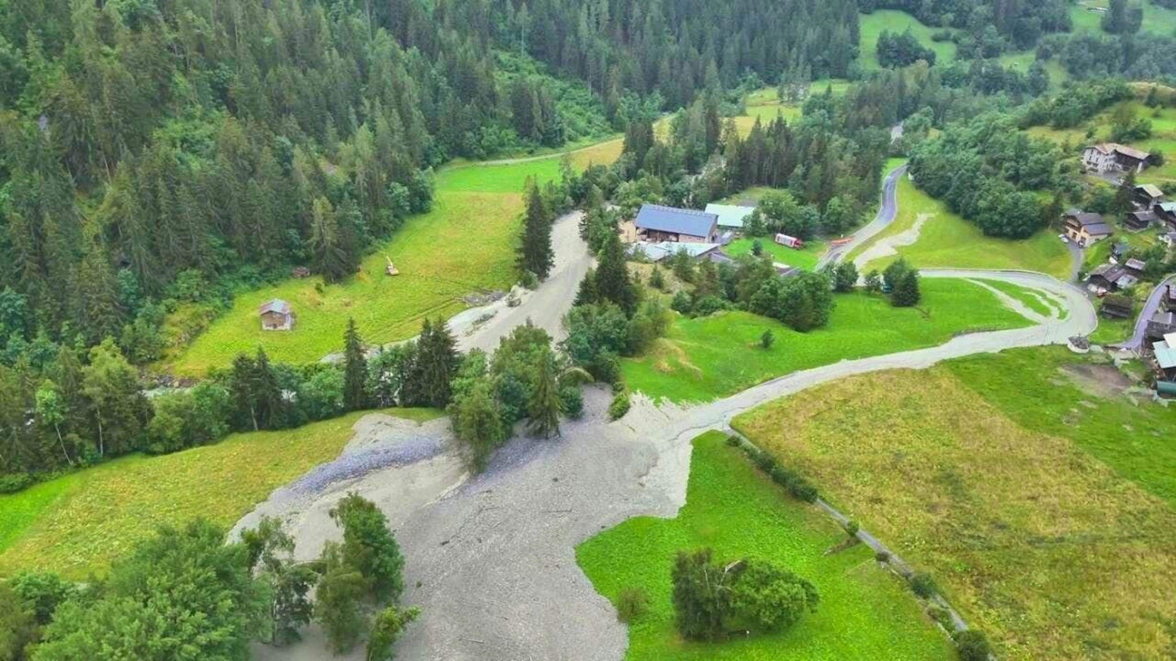 The masses of debris and mud from the torrent rolled down the valley.