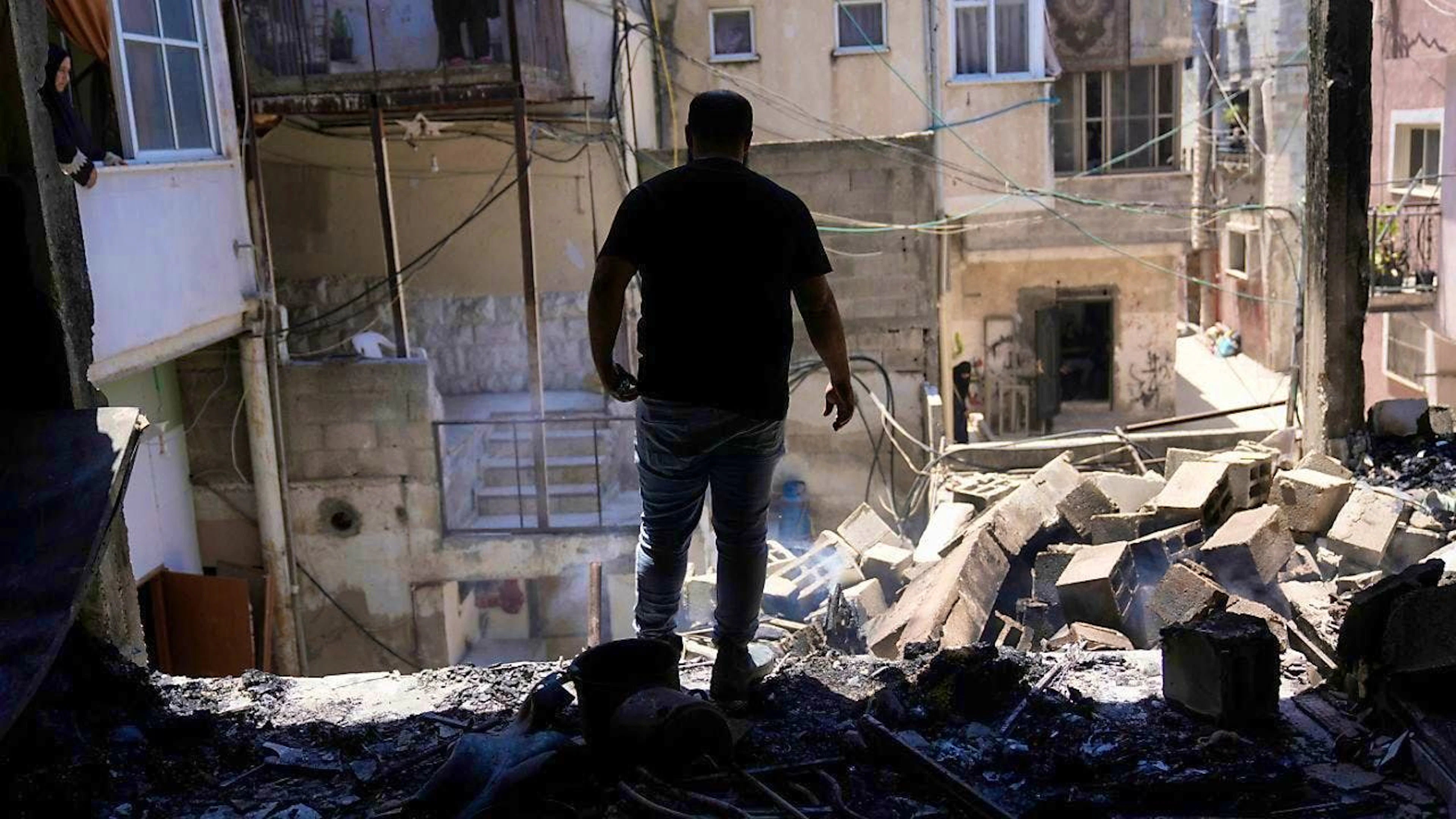 Palestinians survey the destruction after an Israeli operation in the Nur Shams refugee camp near the West Bank town of Tulkarem. Photo: Majdi Mohammed/AP/dpa