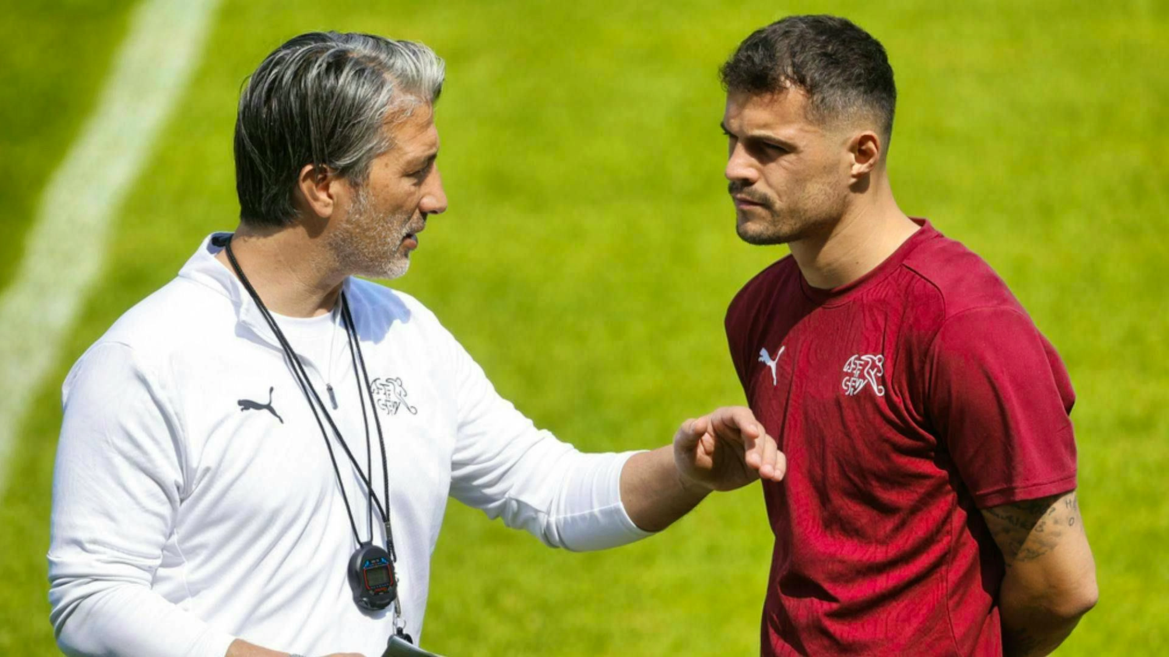 Coach Murat Yakin and captain Granit Xhaka in conversation.