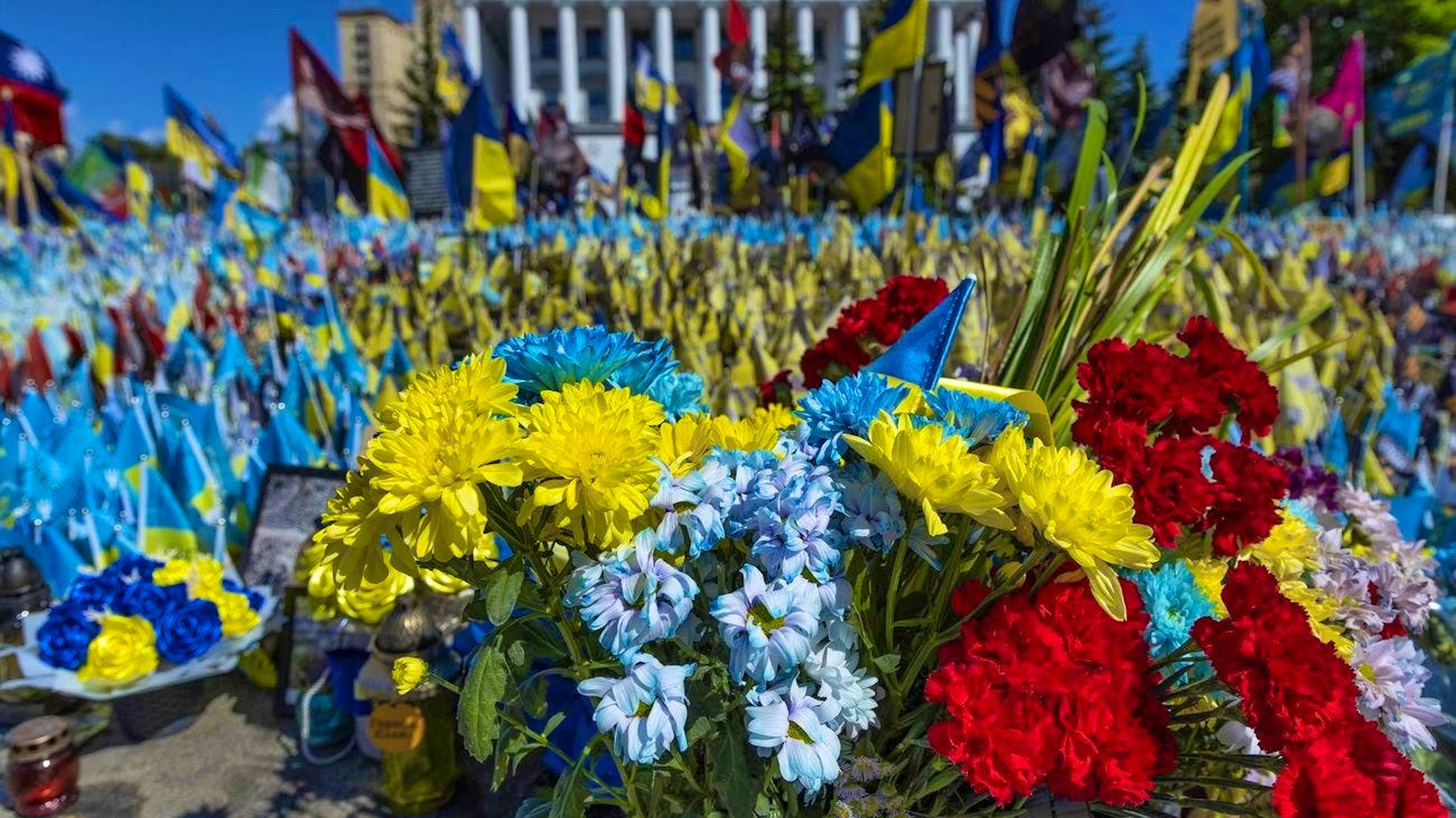 Flowers and flags commemorate fallen soldiers in the capital.