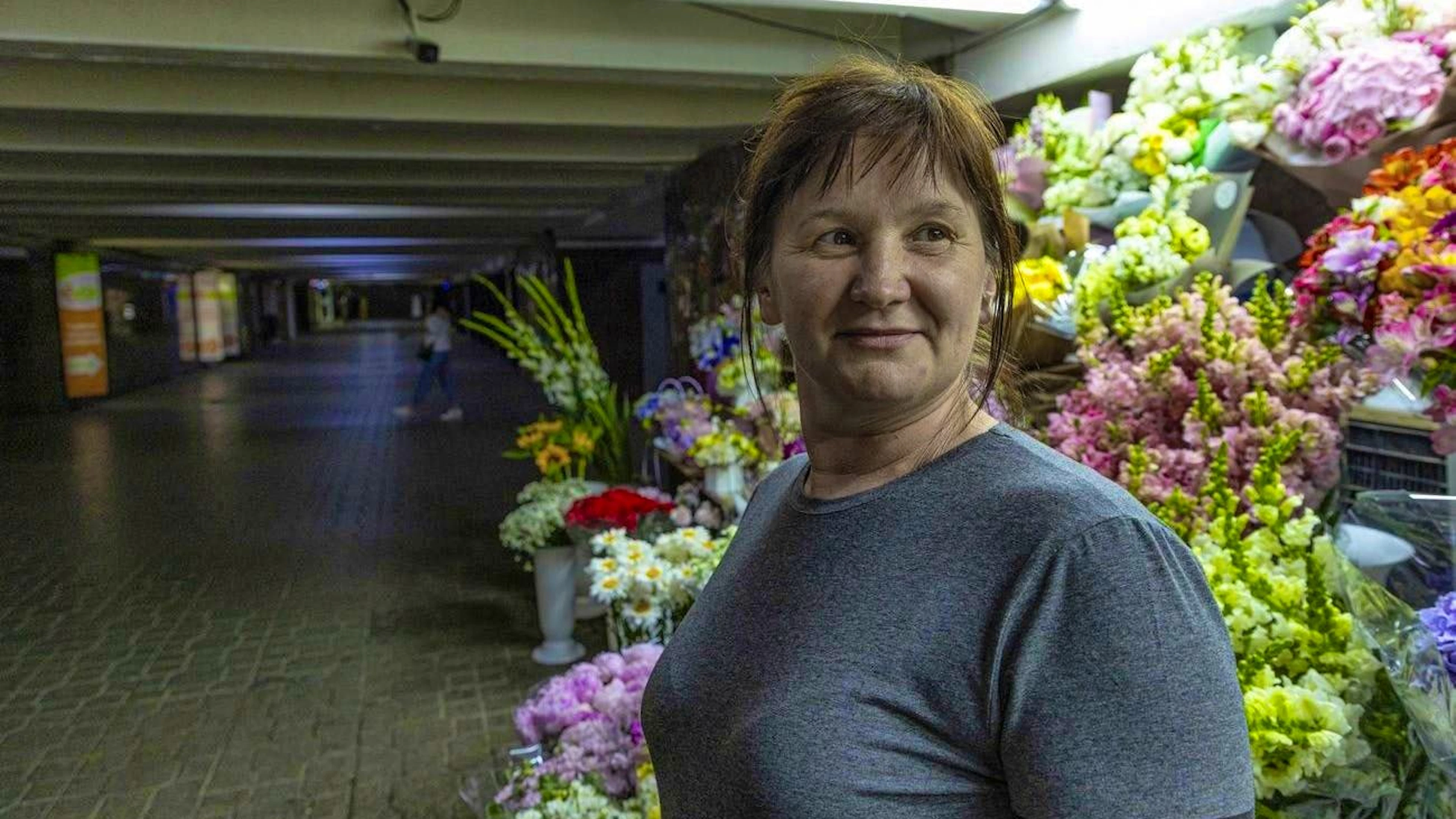 Olha Seminog sells flowers in a Kiev underpass. The photo was taken on June 25.