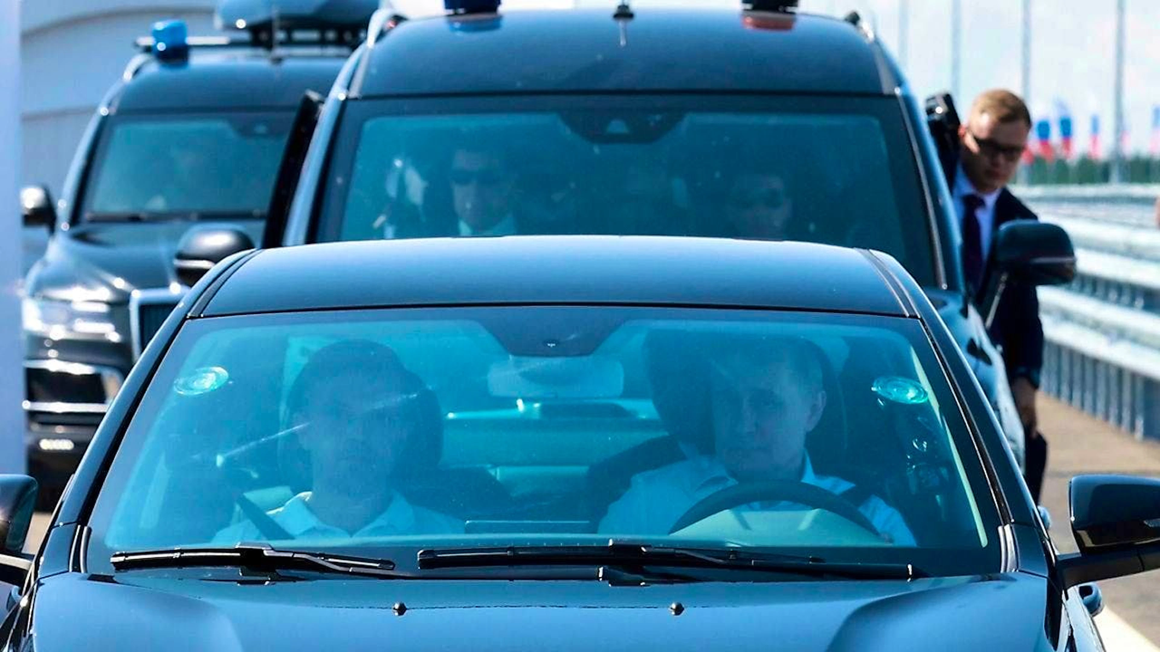 Russian President Vladimir Putin (r) drives a Lada Aura at the opening ceremony. Photo: Vyacheslav Prokofyev/Pool Sputnik Kremlin/AP/dpa