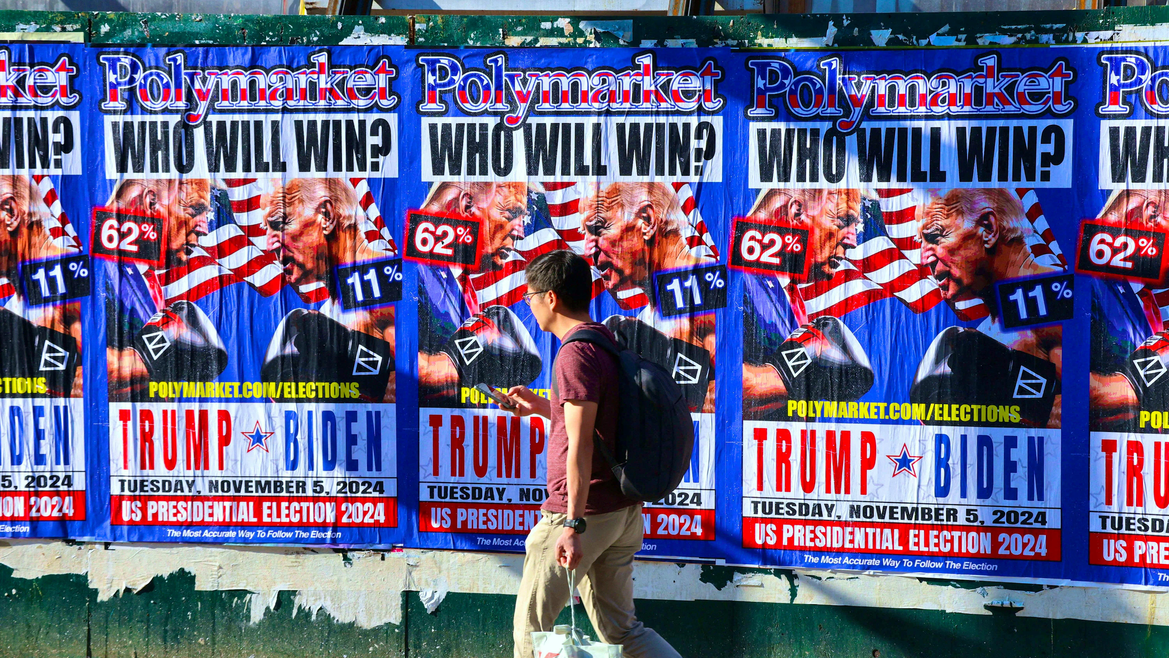 Joe Biden versus Donald Trump: billboard on the street of Polymarket, the world's largest prediction market, in Little Italy in New York on July 15, 2024.