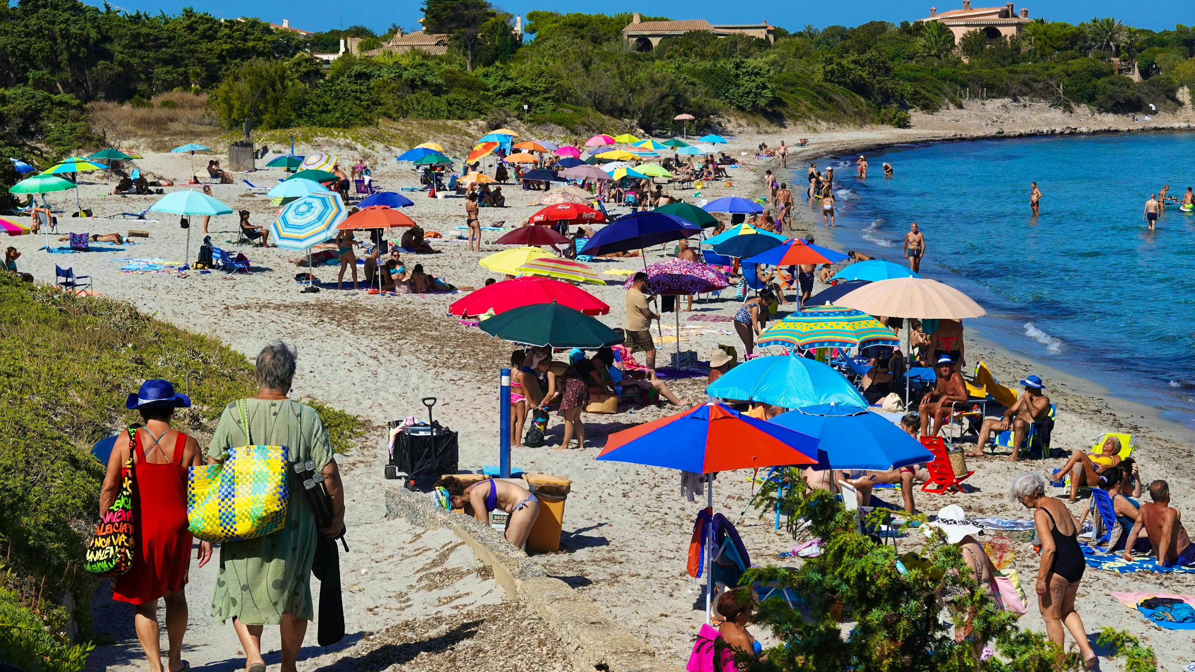 Italy's beaches are also always busy. Here, sun-seekers on the beach in Calasetta in mid-July.