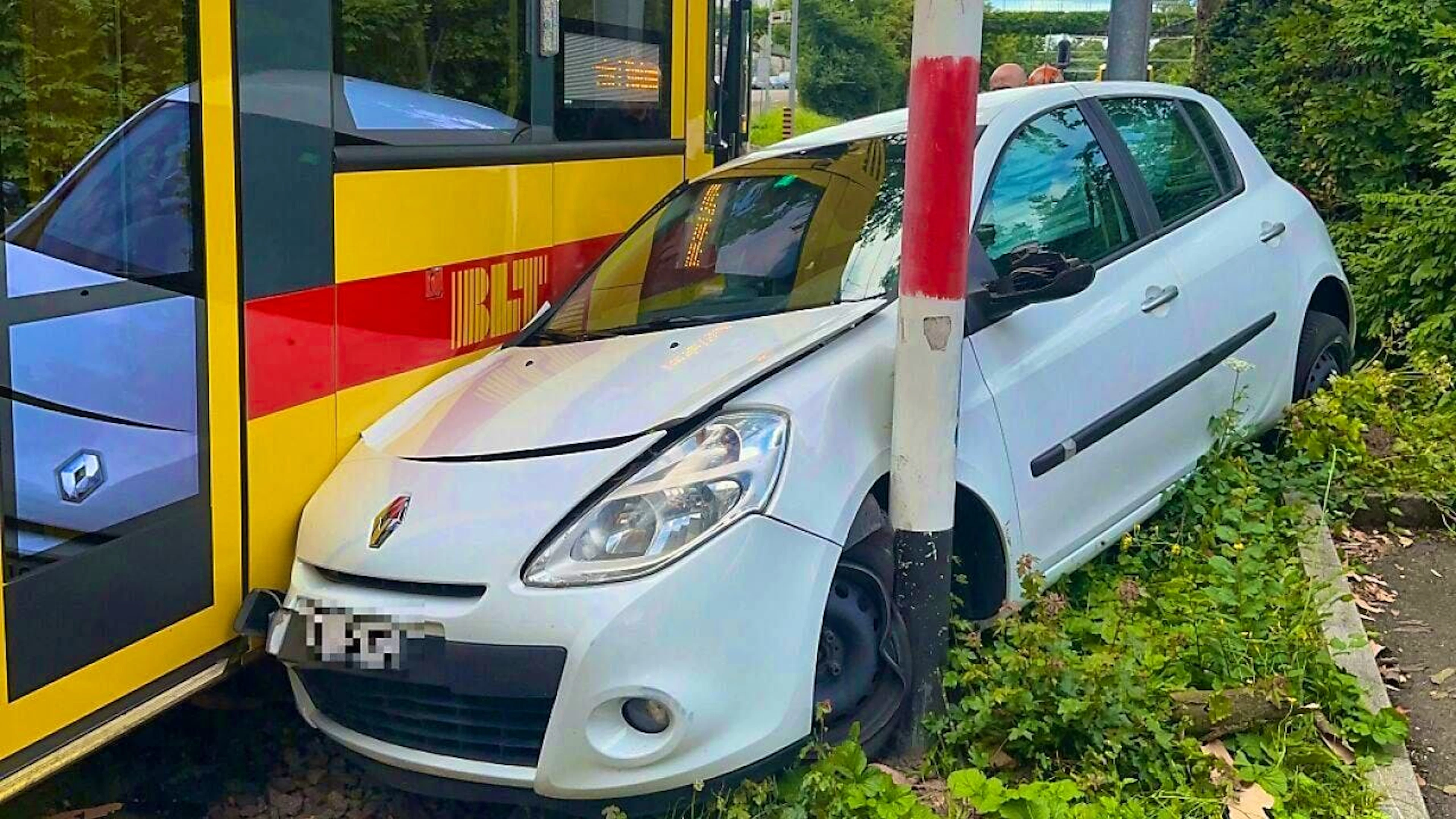 The car was hit by a streetcar as it was turning.