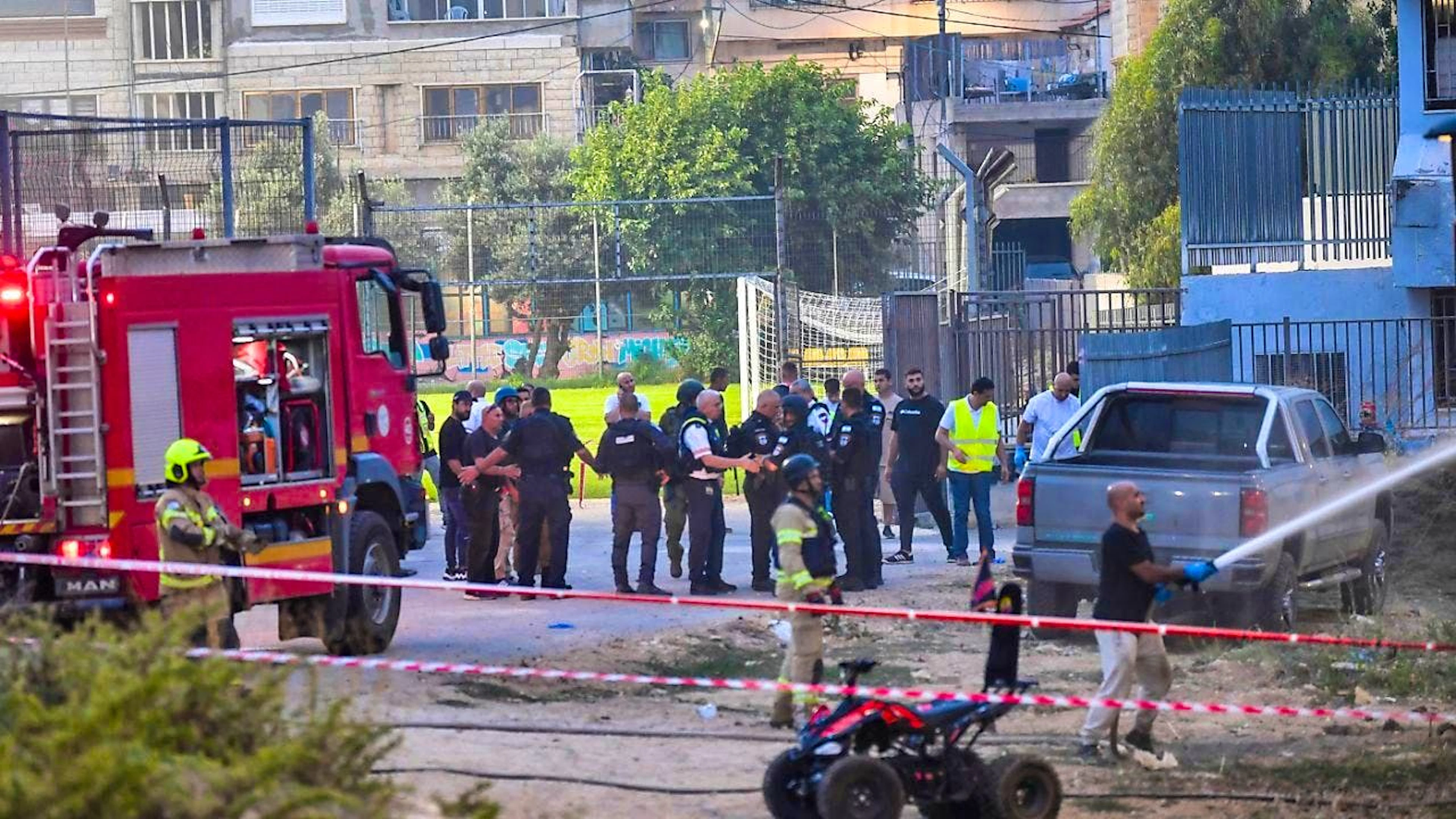 Israeli policemen and firefighters work at the site of a rocket attack on the Golan Heights. Photo: Gil Eliyahu/AP/dpa