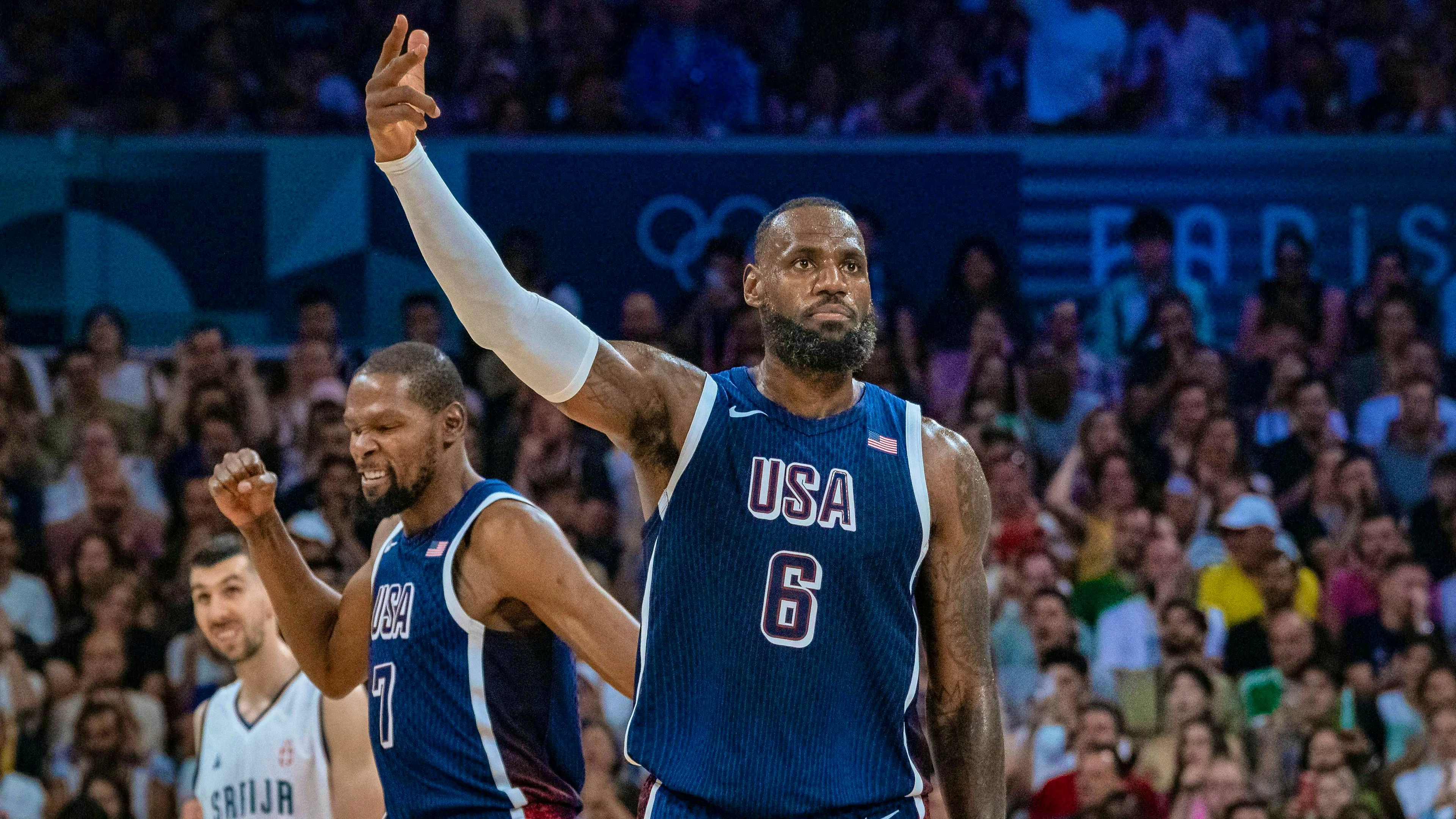 LeBron James (front) and the USA make a convincing start to the Olympic basketball tournament against Serbia