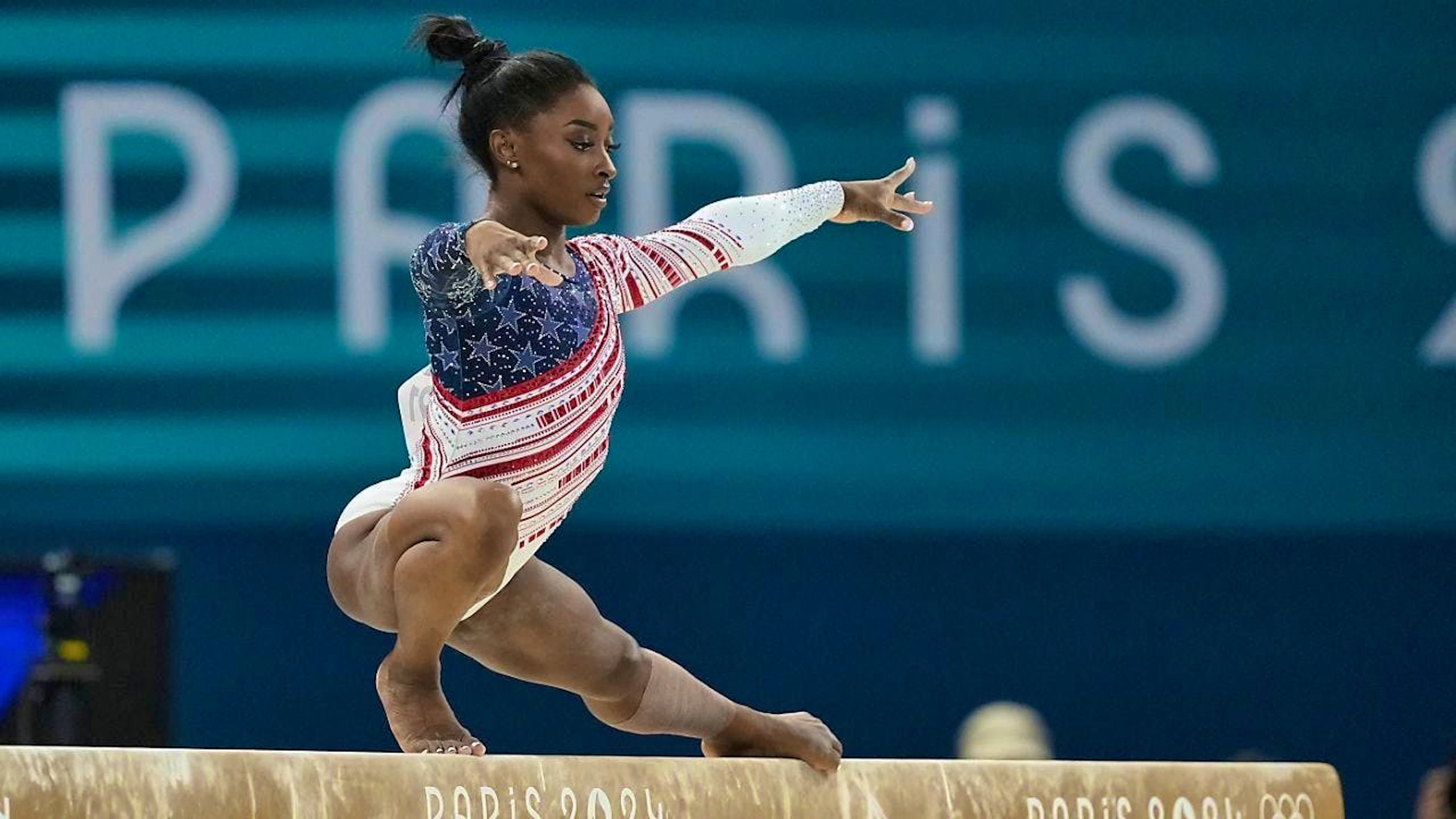 Superstar Simone Biles leads the USA to an unchallenged victory in the women's artistic gymnastics team final.