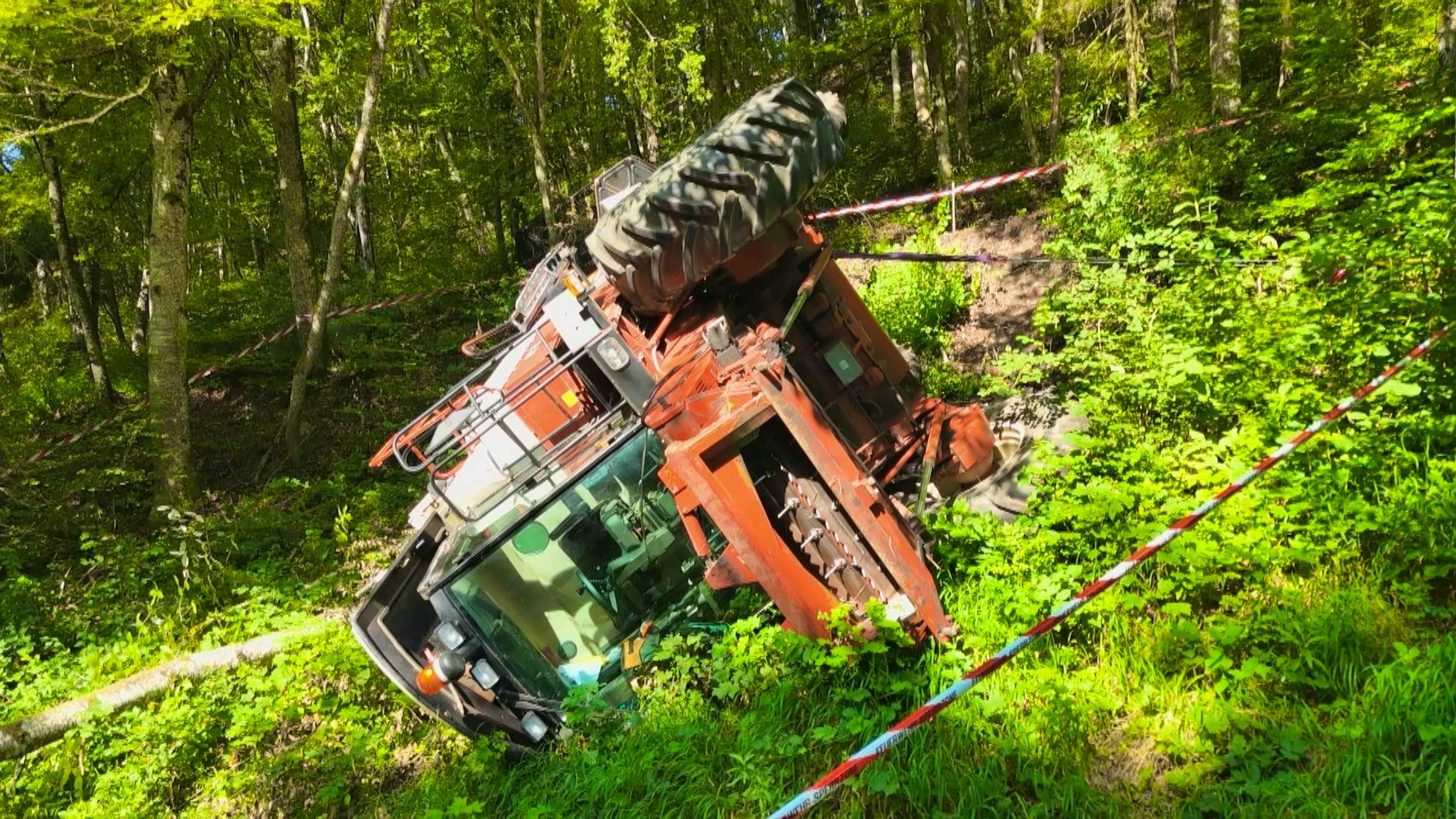 The combine harvester is still lying in the forest. 