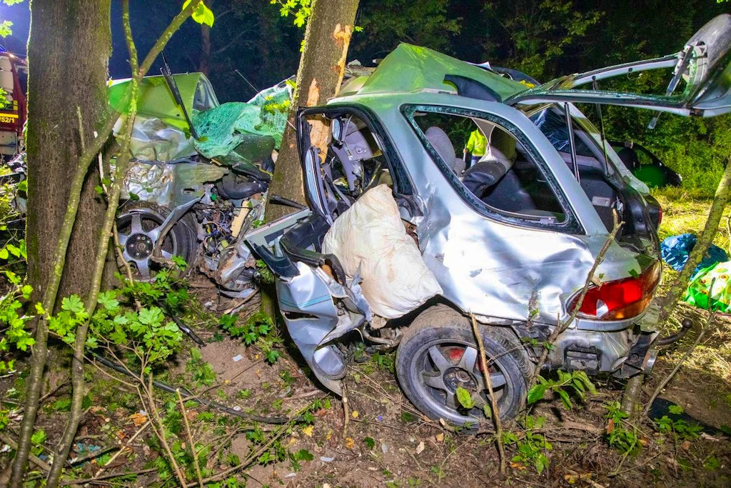 Car wraps around tree - horror accident claims two lives