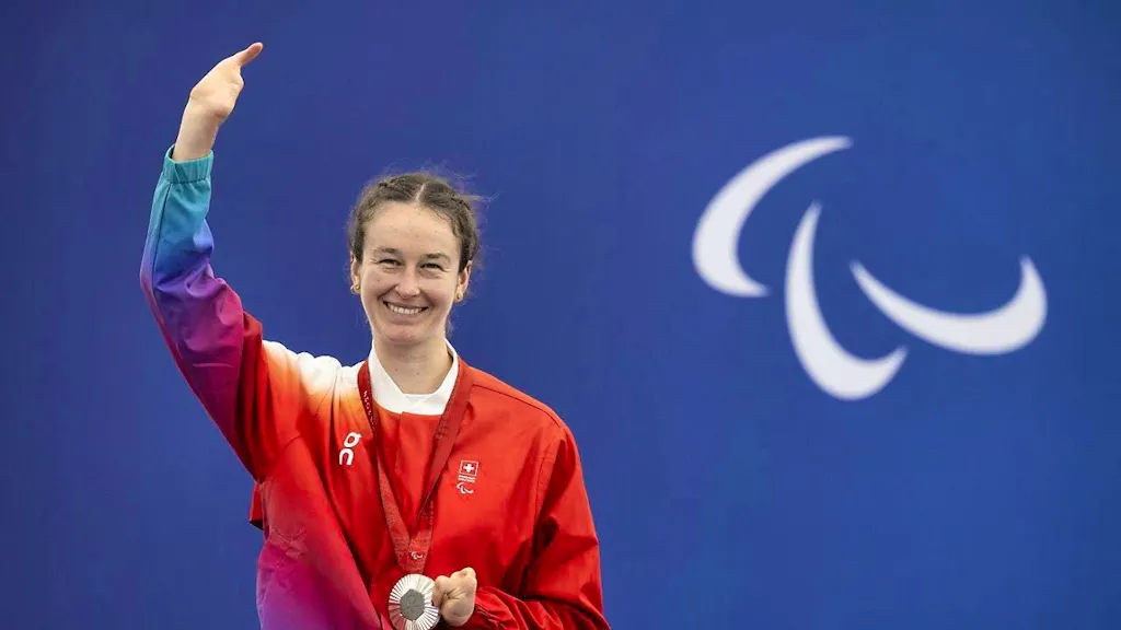 Flurina Rigling flag bearer at the closing ceremony