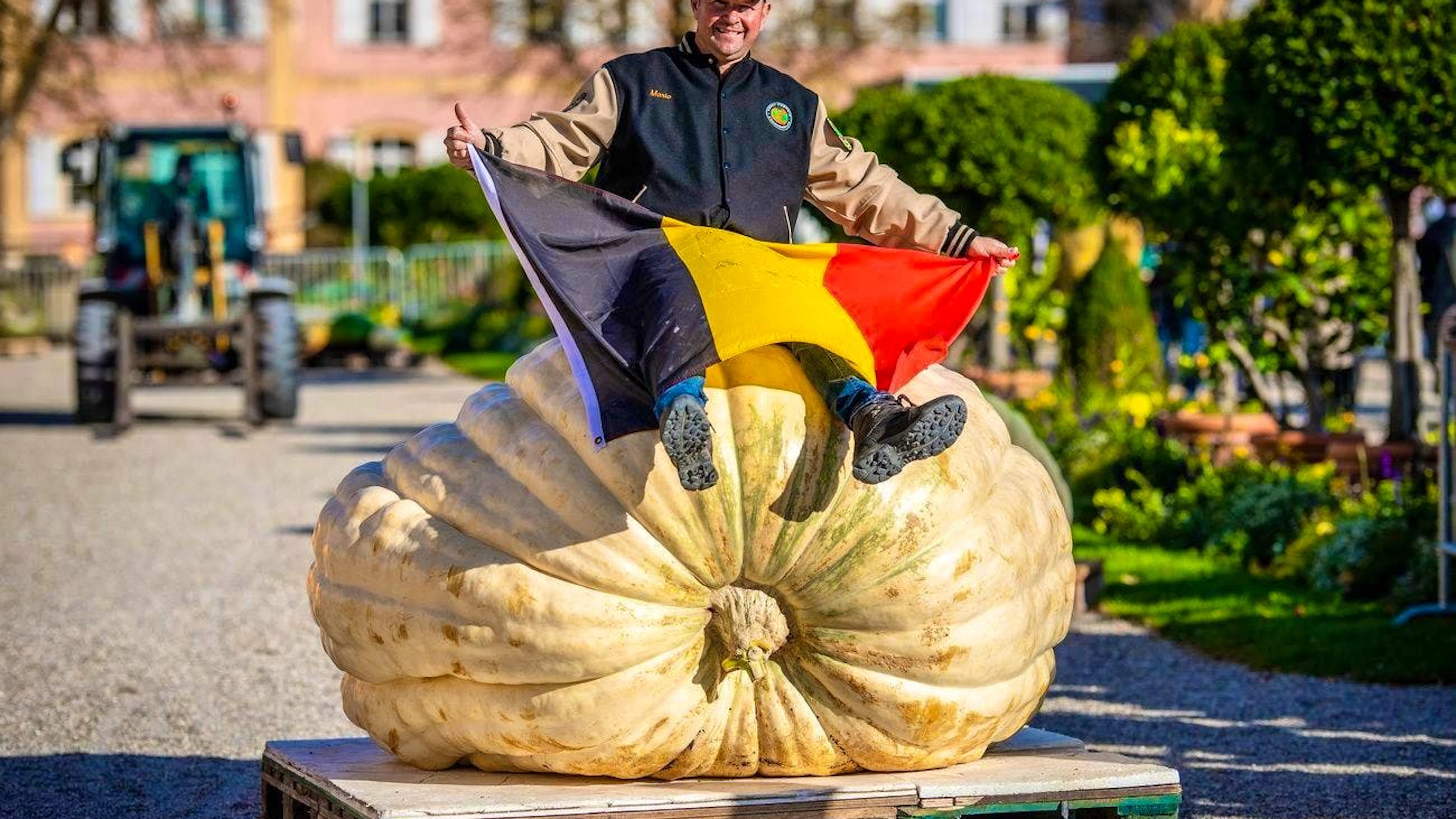 Belgian Mario van Geel celebrates his victory at the European Pumpkin Weighing Championships. His pumpkin weighs 1152 kg.