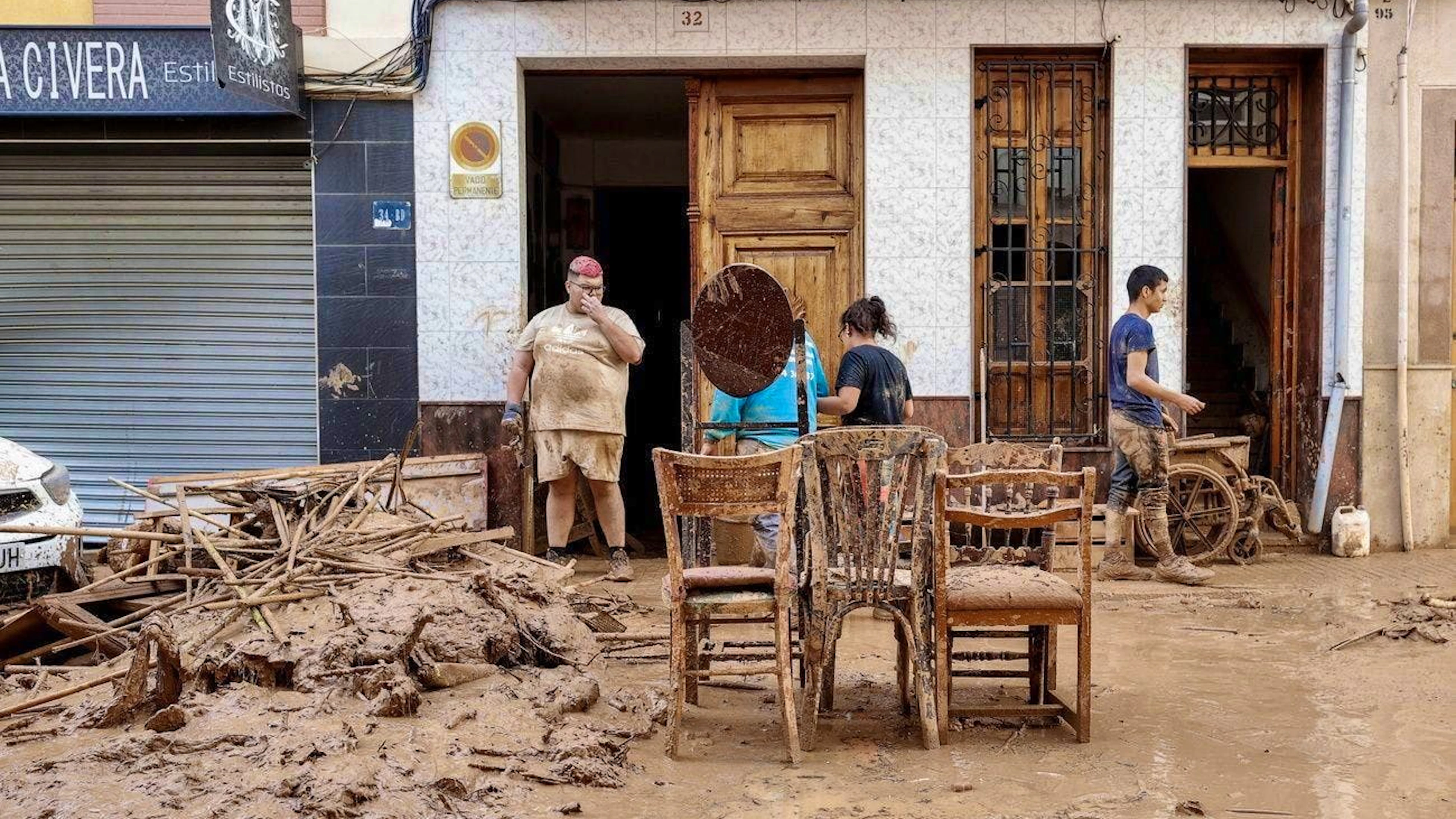 Residents salvage furniture in the flooded community of Paiporta in the province of Valencia.