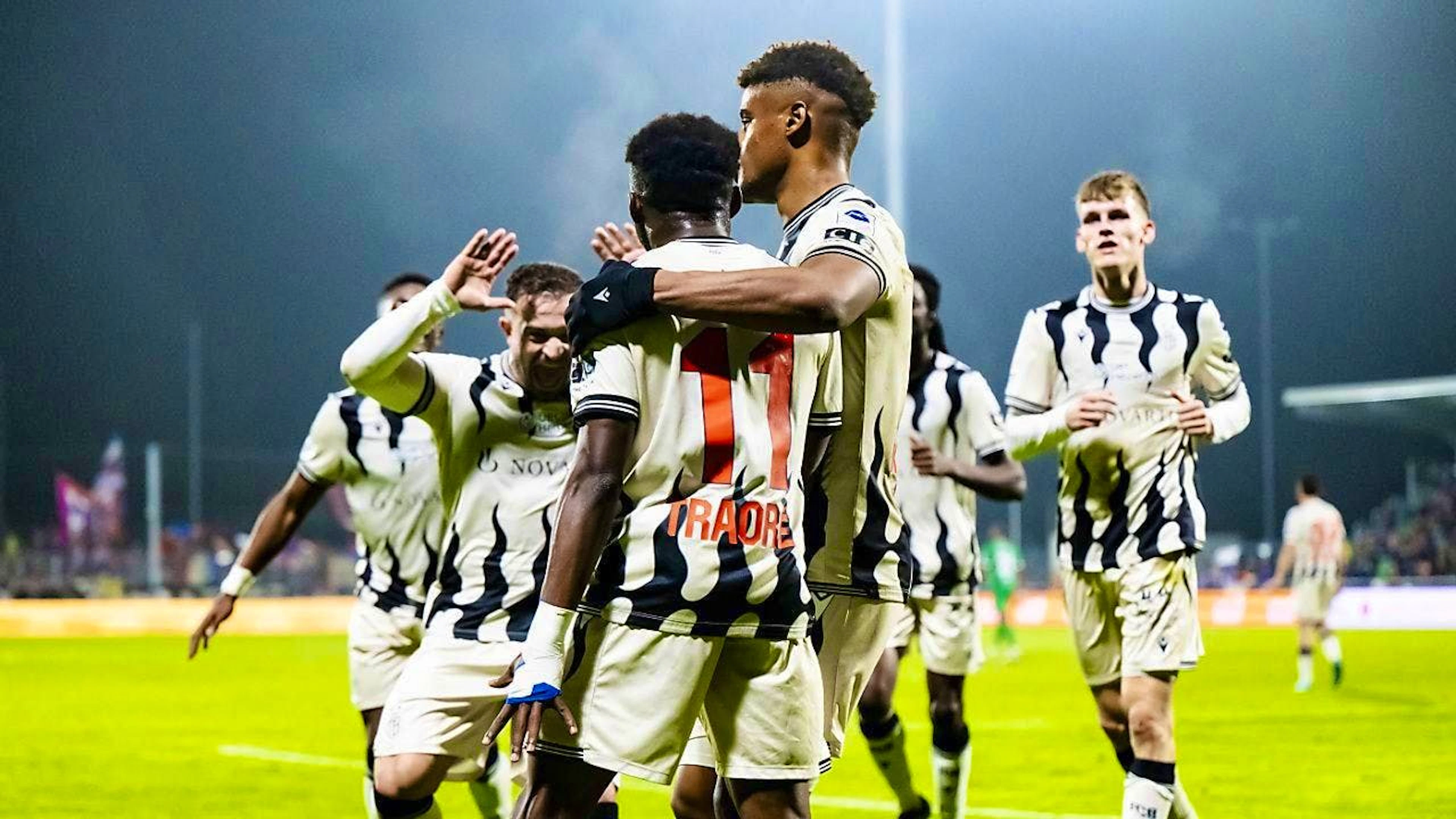Xherdan Shaqiri celebrates with goalscorers Traoré and Kevin Carlos