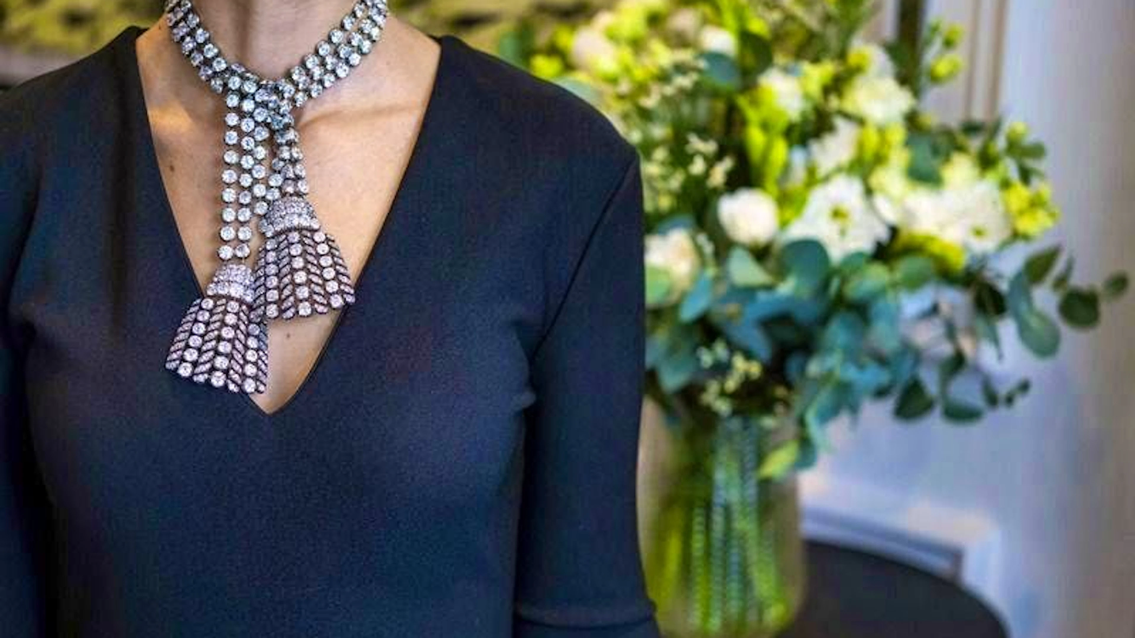 A Sotheby's employee shows the rare, historic diamond necklace from the 18th century.