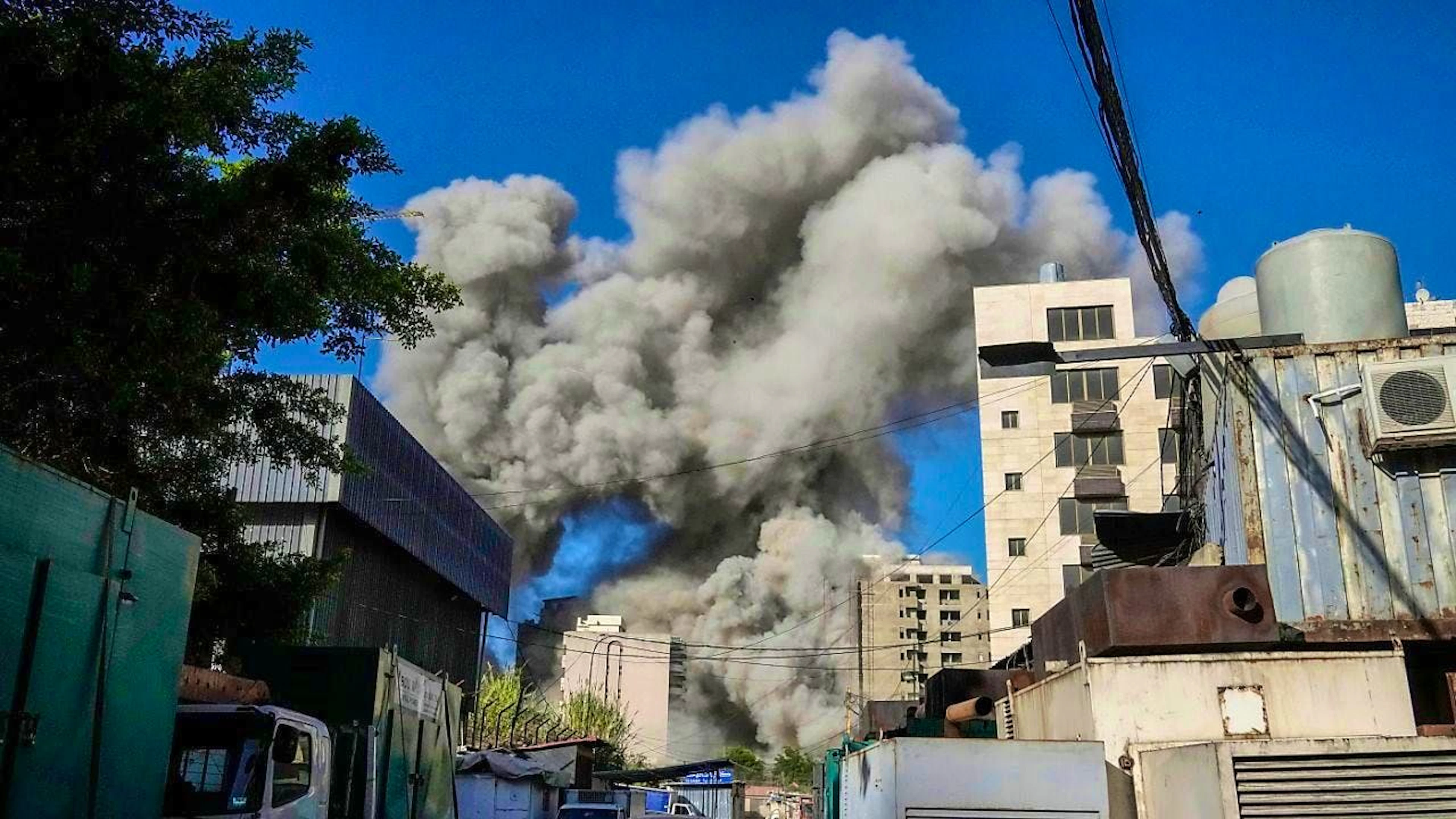 Smoke rises from a building that collapsed after an Israeli airstrike in Chijah, south of Beirut. Photo: Bilal Hussein/AP/dpa
