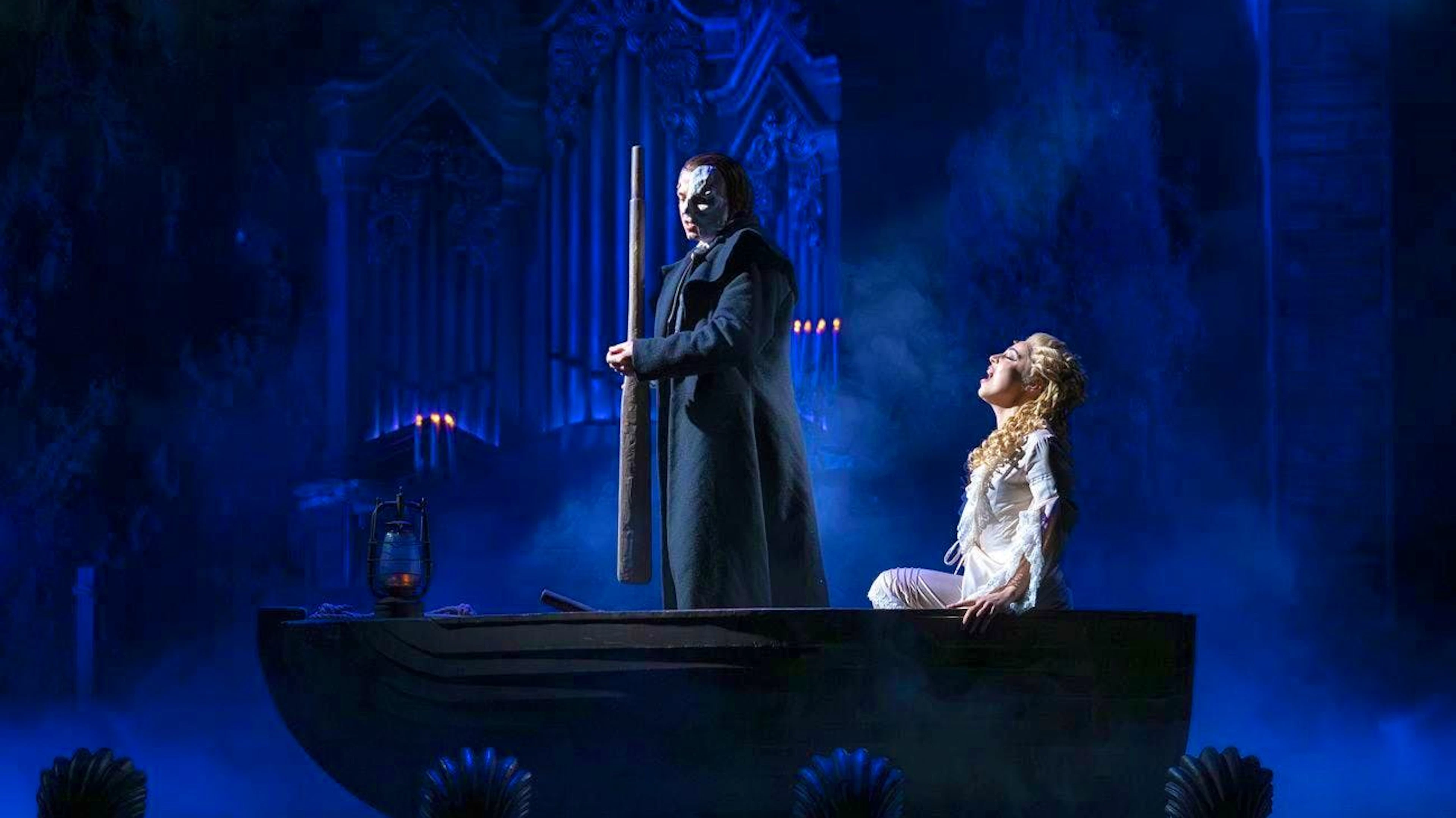 Nadim Naaman (The Phantom), left, and Georgia Wilkinson (Christine), right, in a scene from "The Phantom of the Opera" by Andrew Lloyd Webber.