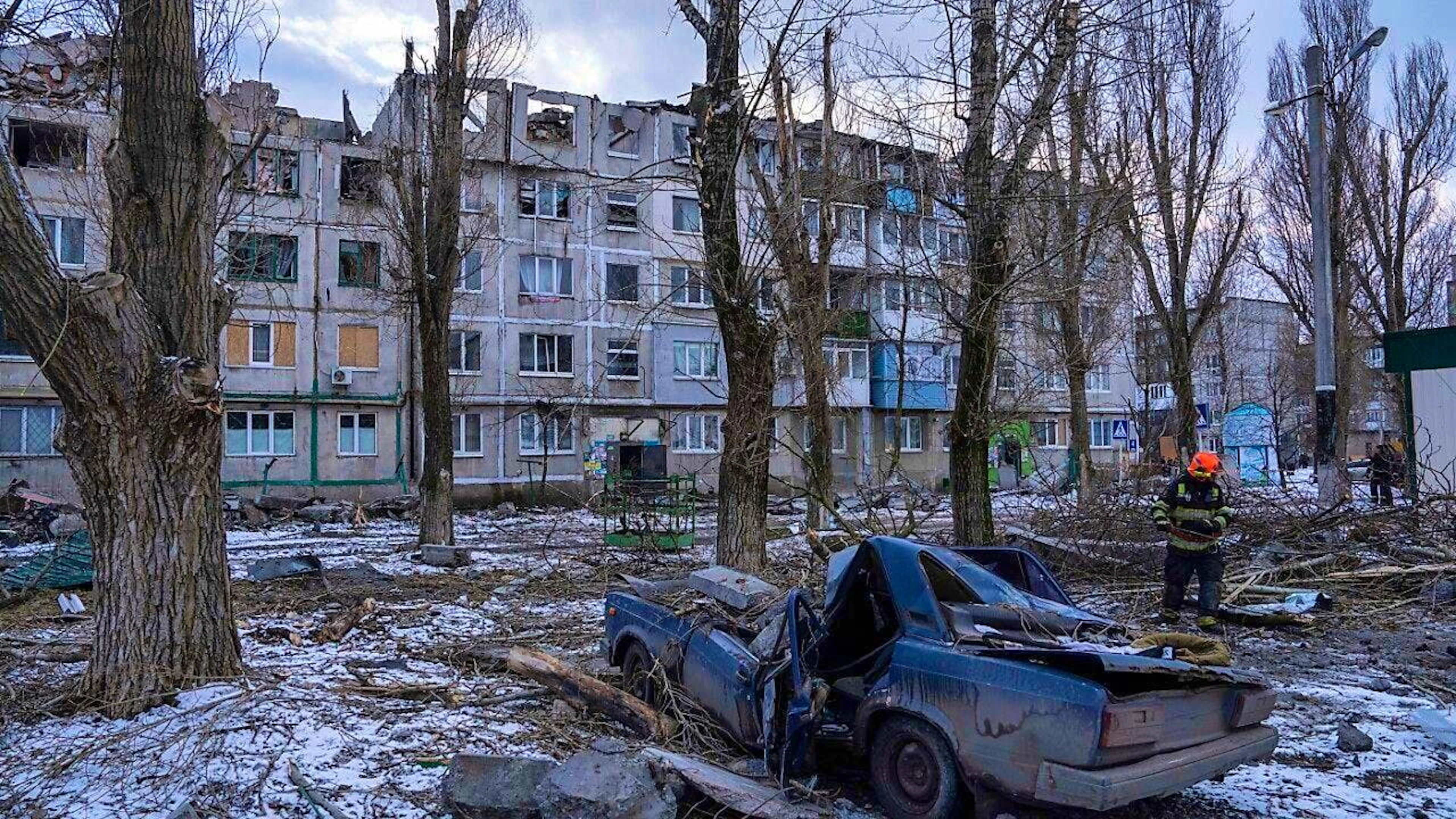 ARCHIVE - A rescue worker clears the rubble from a house destroyed by a rocket. Photo: Evgeniy Maloletka/AP/dpa