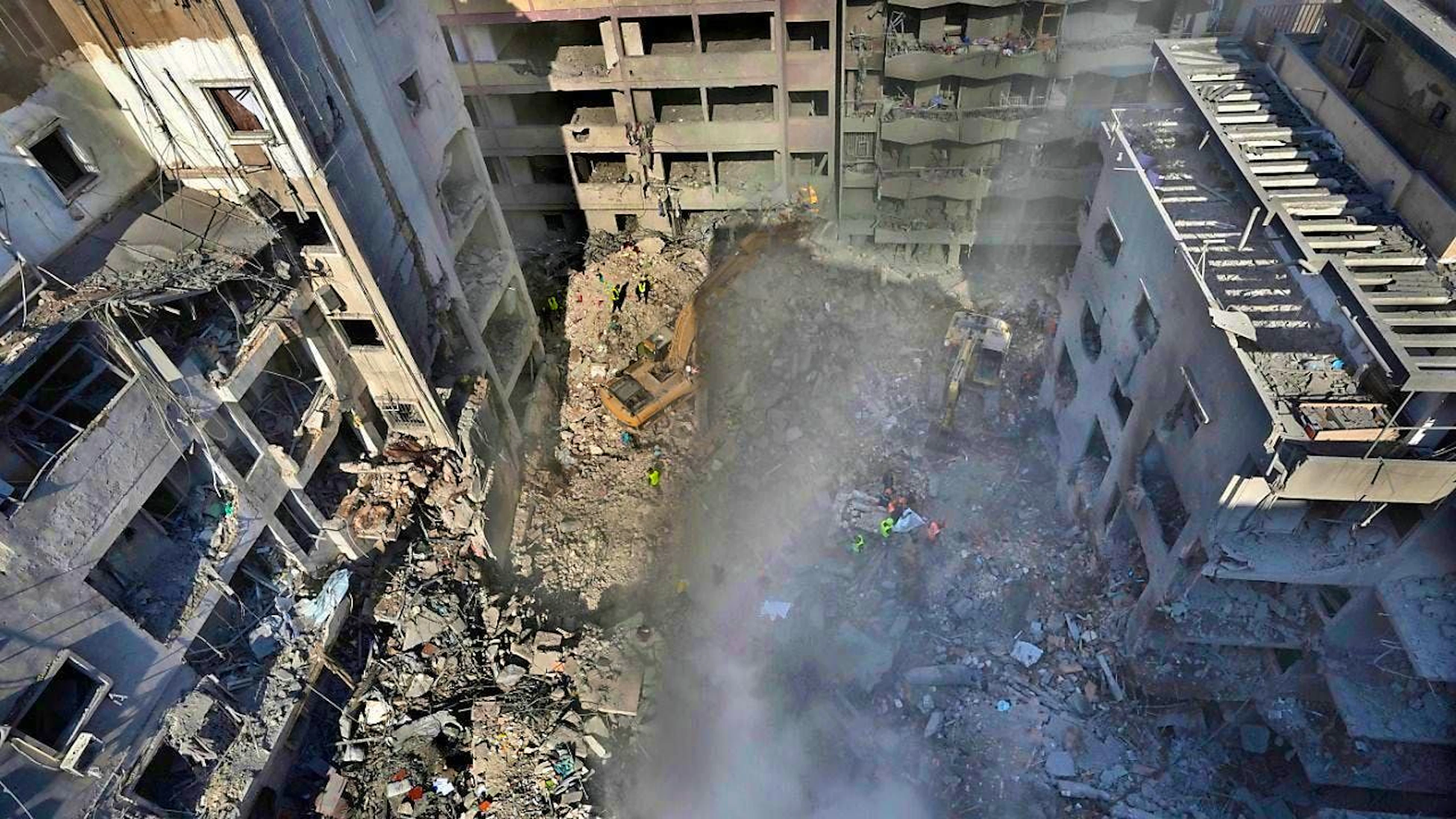 Rescue workers search for victims of an Israeli airstrike on the center of Beirut. Photo: Hussein Malla/AP