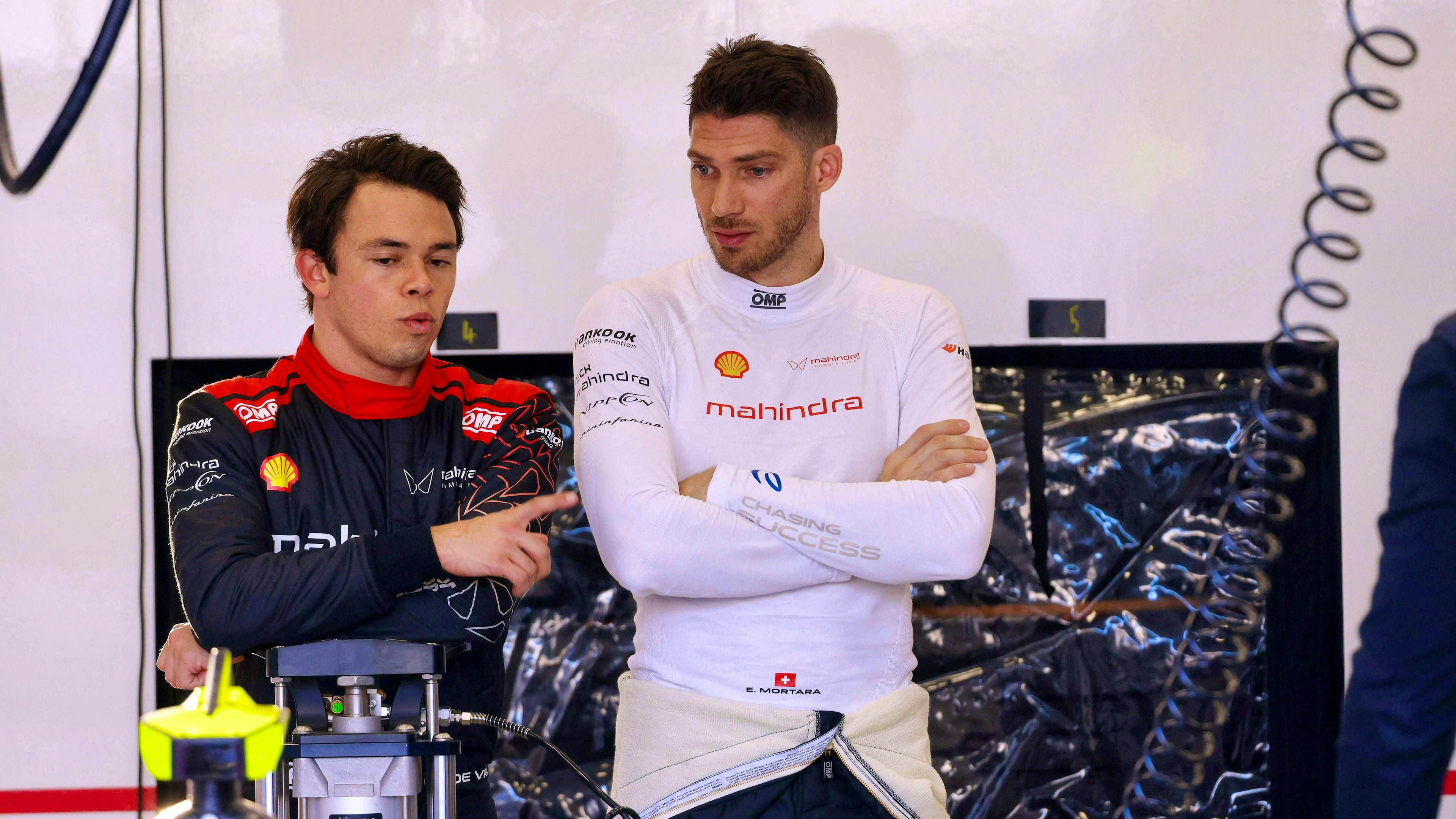 Edoardo Mortara (right) in conversation with teammate and former world champion Nyck De Vries.