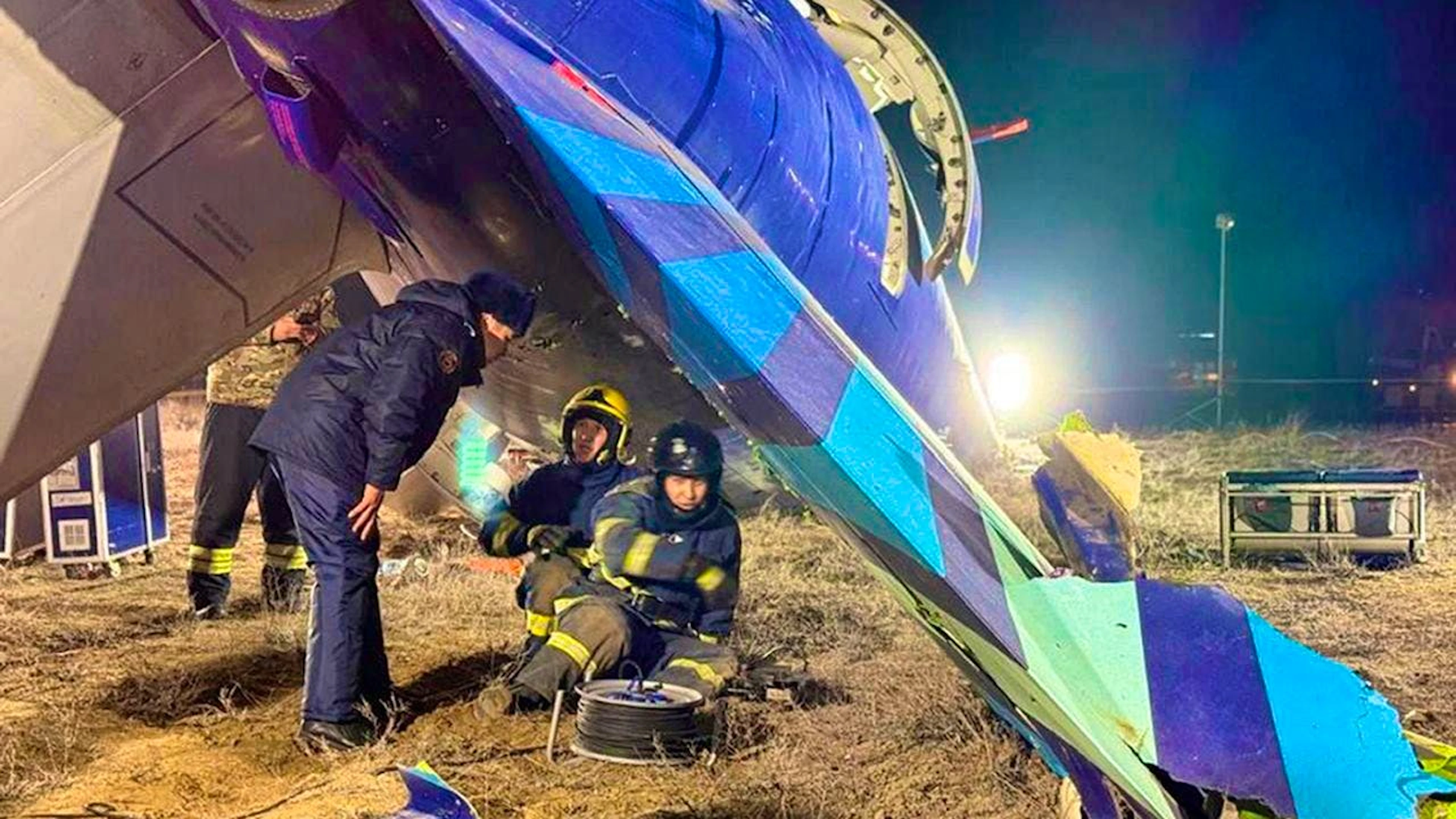 HANDOUT - Rescue workers work on the wreckage. Photo: Uncredited/Kazakhstan's Emergency Ministry/AP/dpa - ATTENTION: For editorial use only in connection with current reporting and only with full citation of the above credit