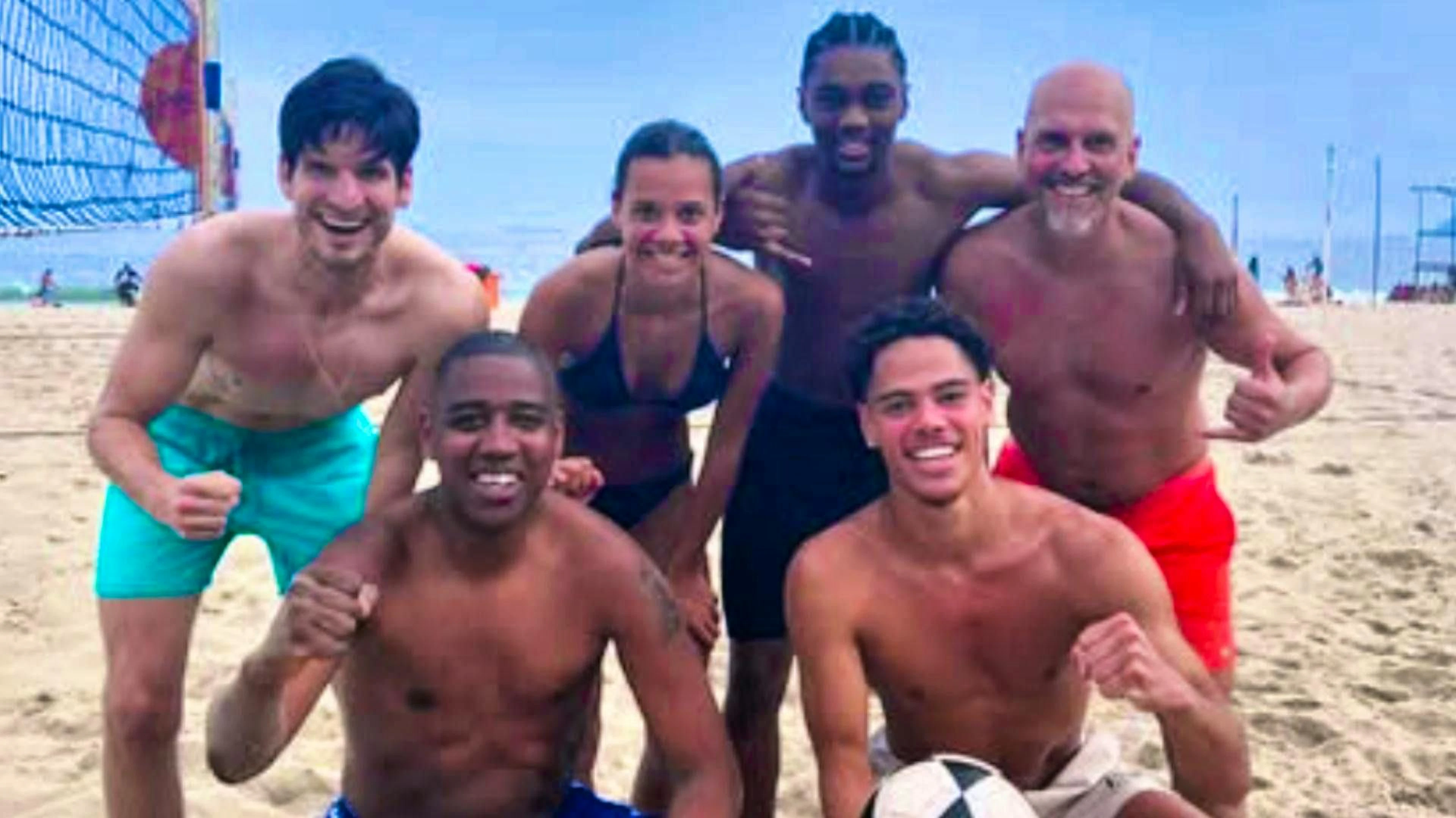 Iman Beney and her brother Roméo (bottom right) kick a ball on the beach in Brazil with Timm Klose (left) and Gelson Fernandes (bottom left), among others.