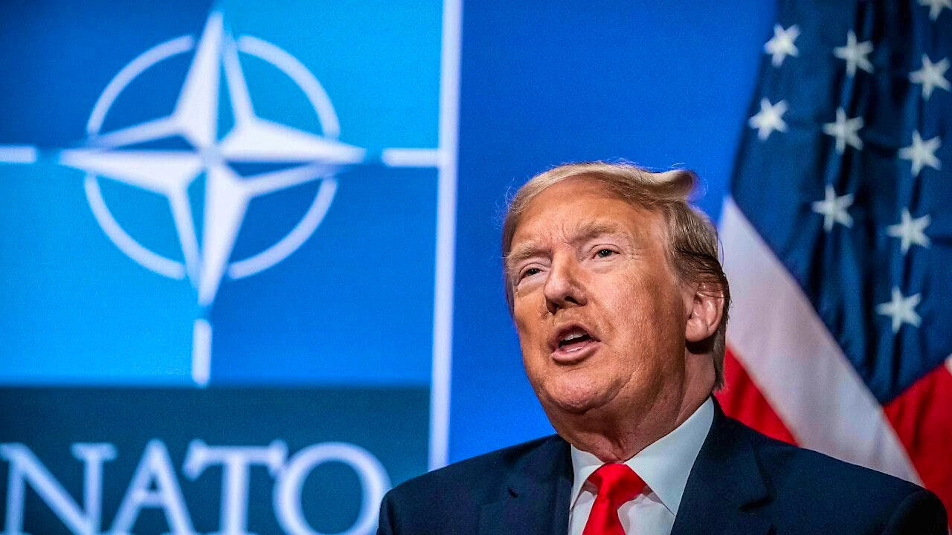 ARCHIVE - US President-elect Donald Trump in front of the NATO logo. Photo: Michael Kappeler/dpa