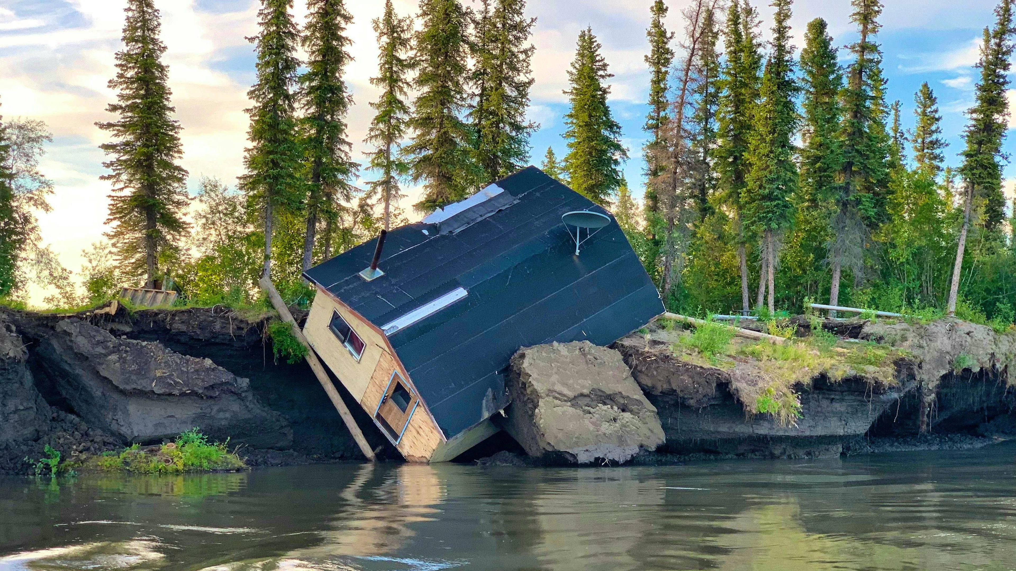 A hut in Canada destroyed by permafrost thaw and erosion on the Mackenzie River delta.