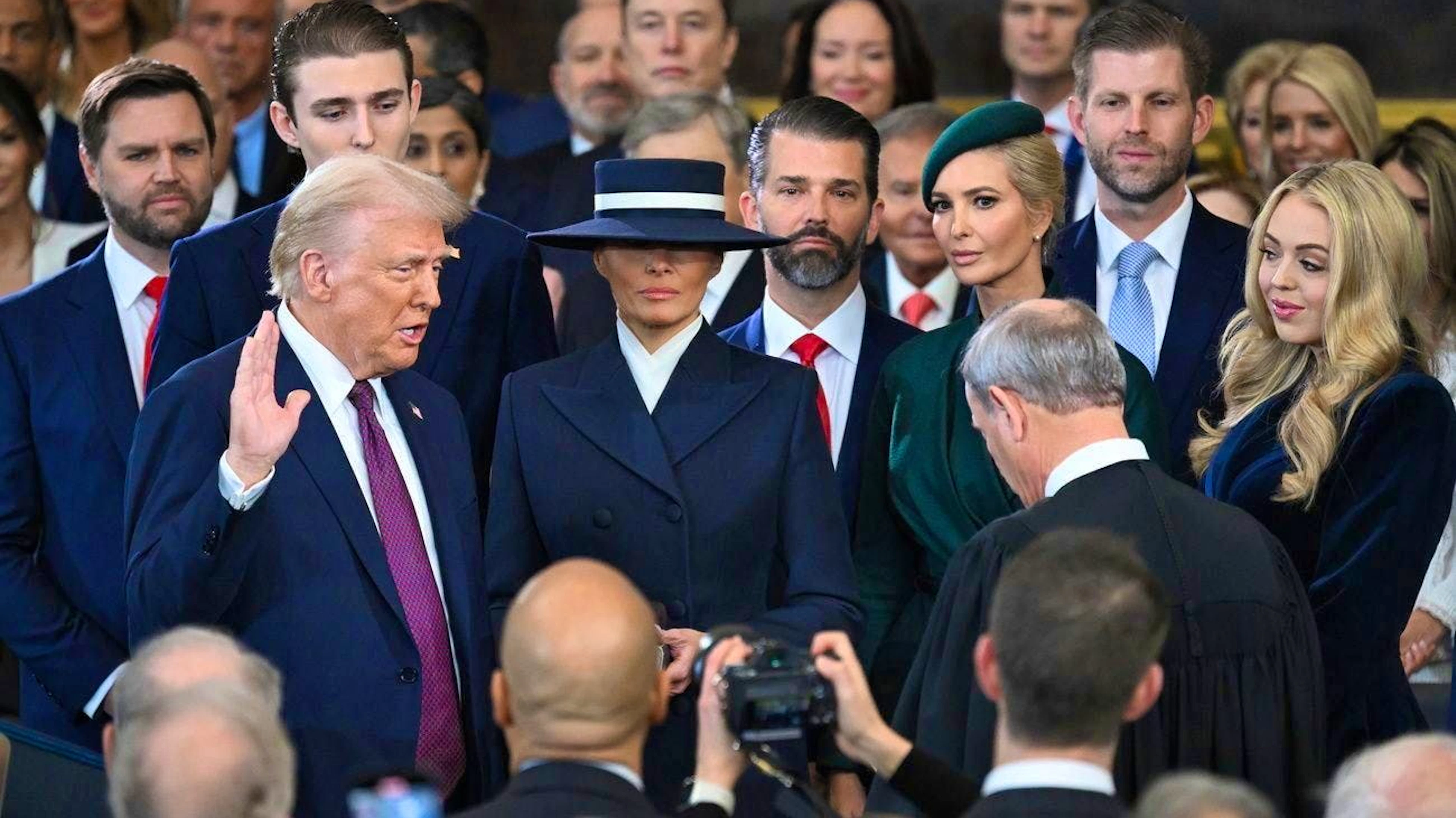 Donald Trump takes the oath - framed by his family and Vice President JD Vance.