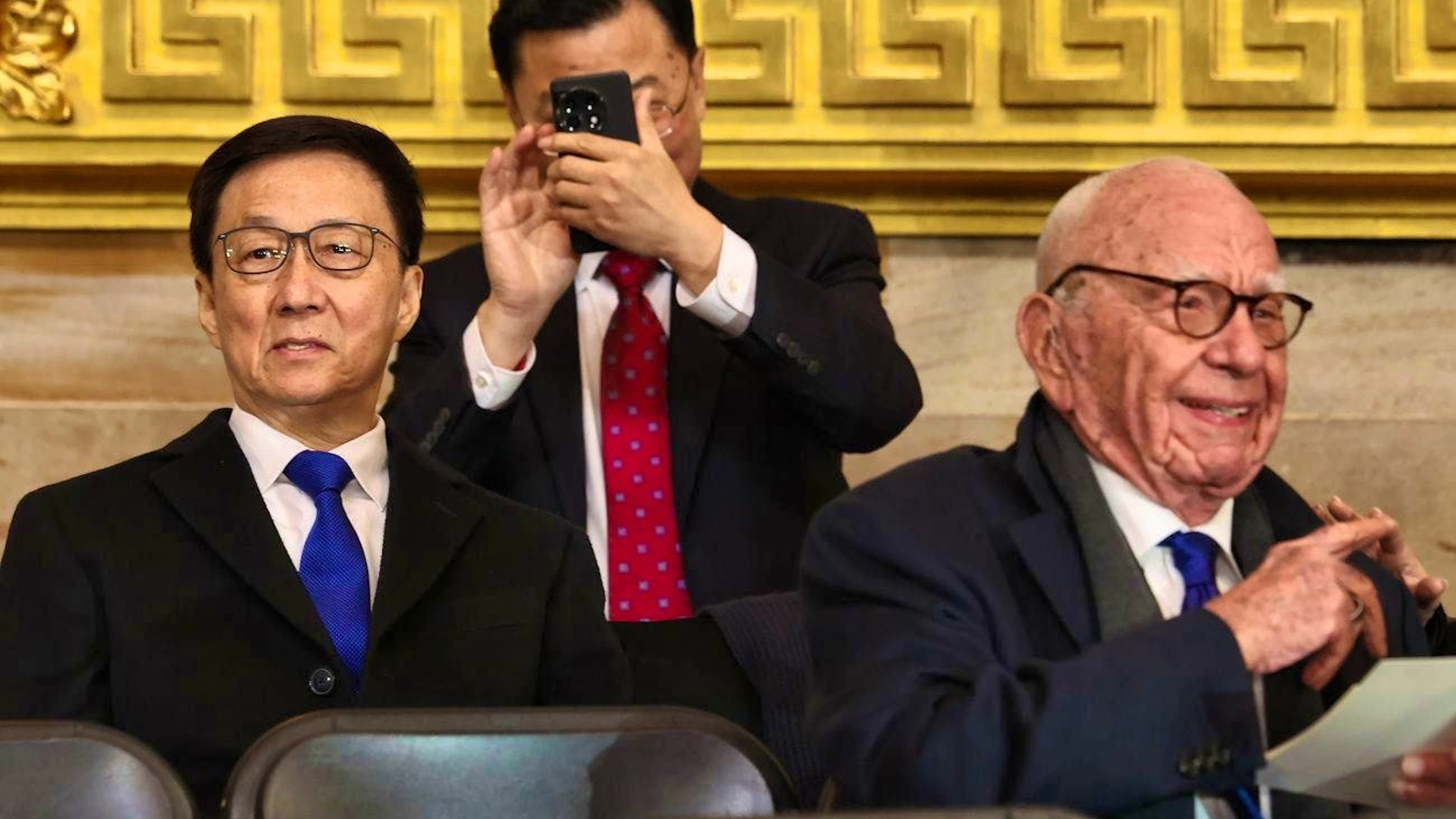 China's President Han Zheng (left) to media tycoon Rupert Murdoch (right).