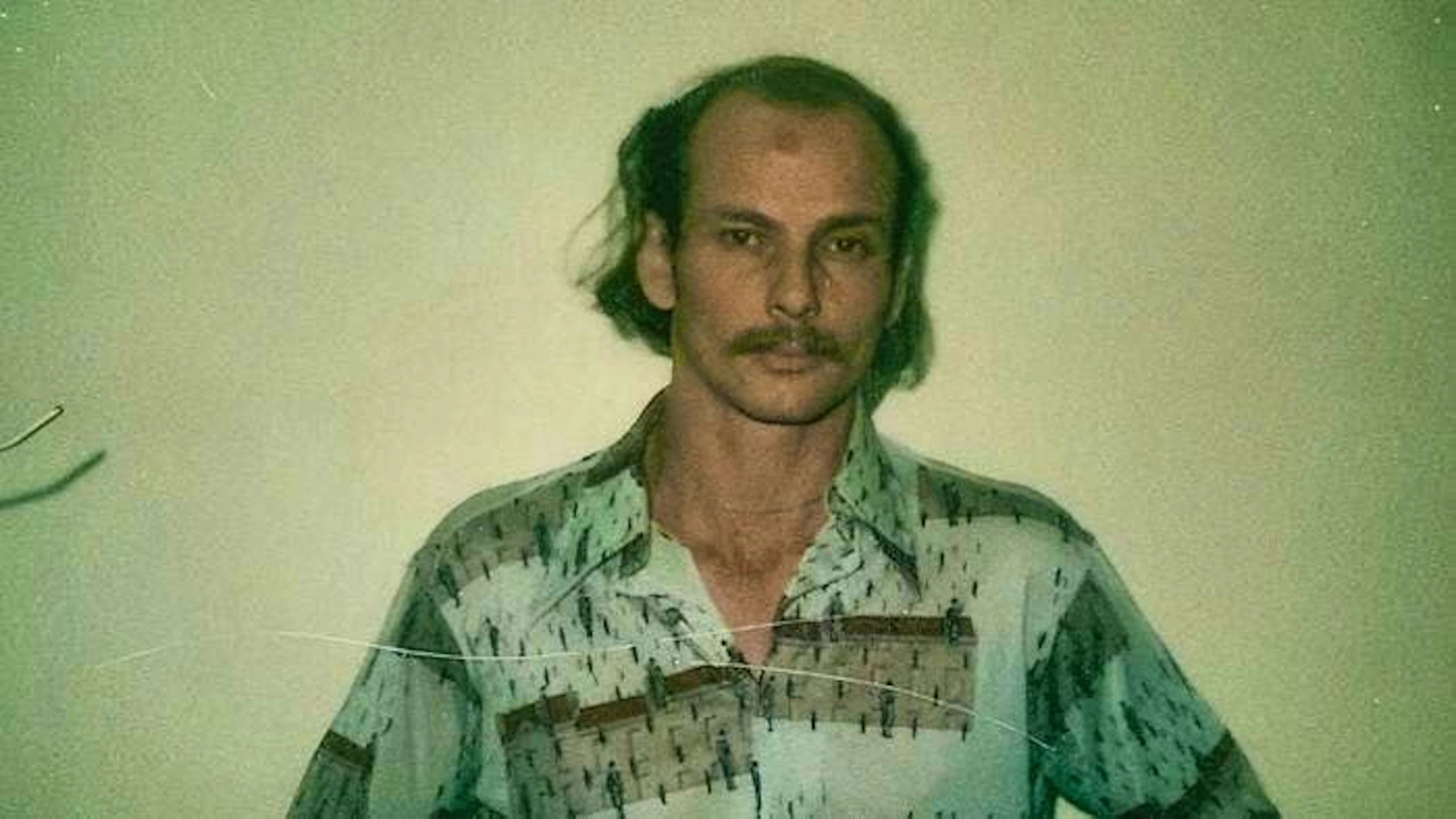 Jonathan Reed: The photo shows the man after he was arrested for another rape. Karen Hoy tries to find out whether he is Jeannie Wadle's murderer in "The Stewardess Murders".