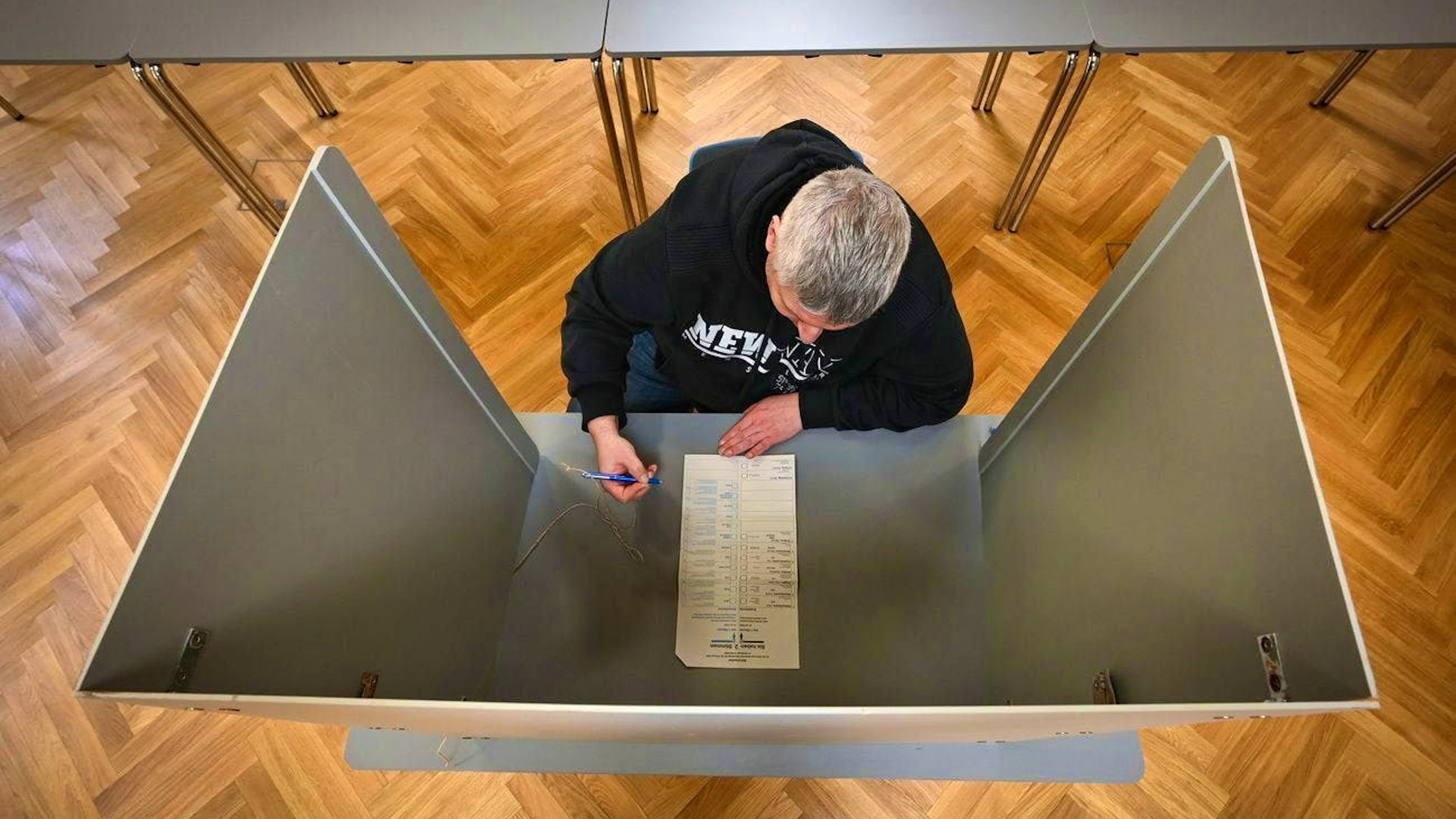 A voter in Saxony on Sunday: Germany is deeply divided.