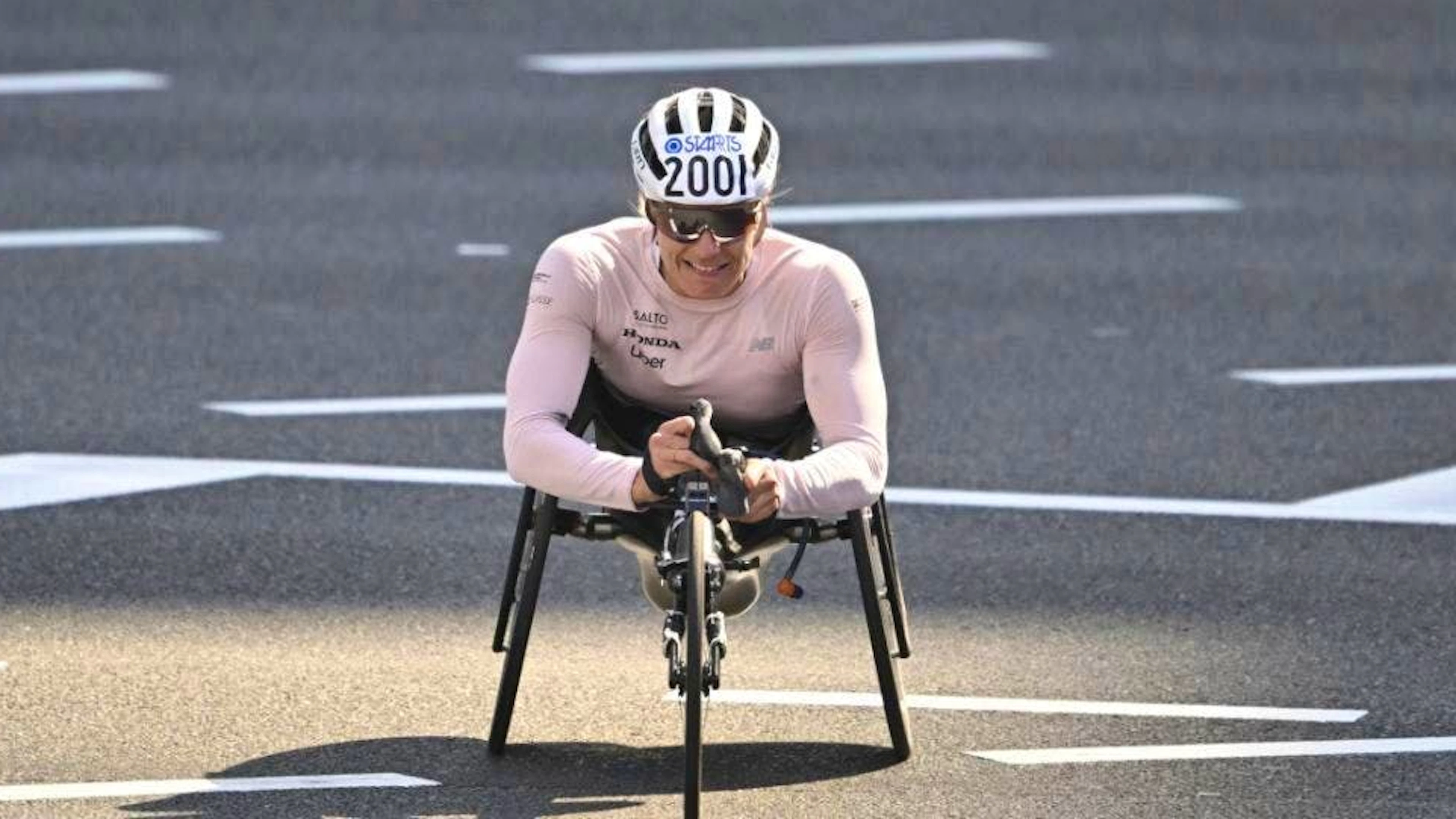 Catherine Debrunner crosses the finish line first at the Tokyo Marathon.