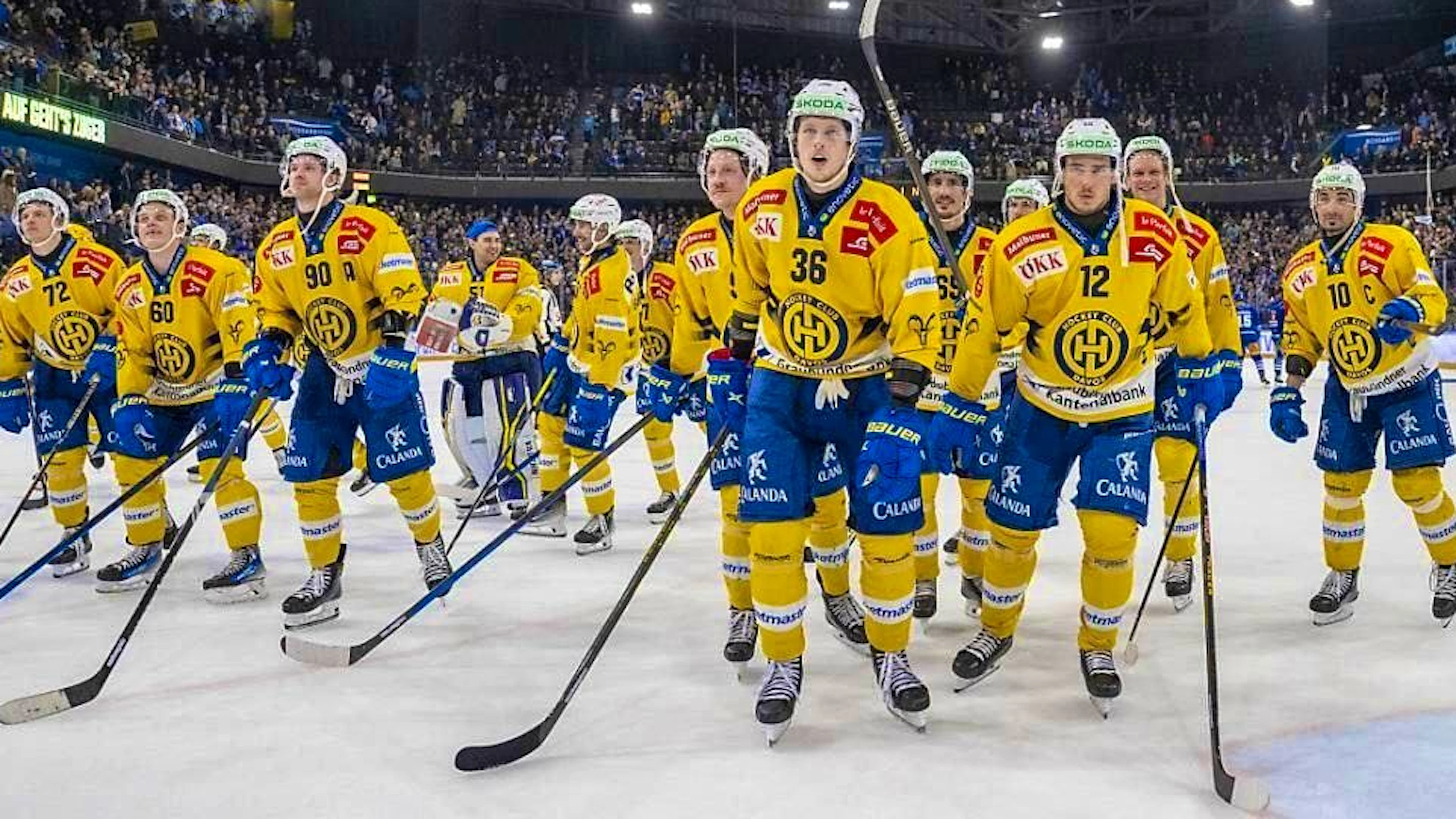 The Davos players are celebrated by the fans.