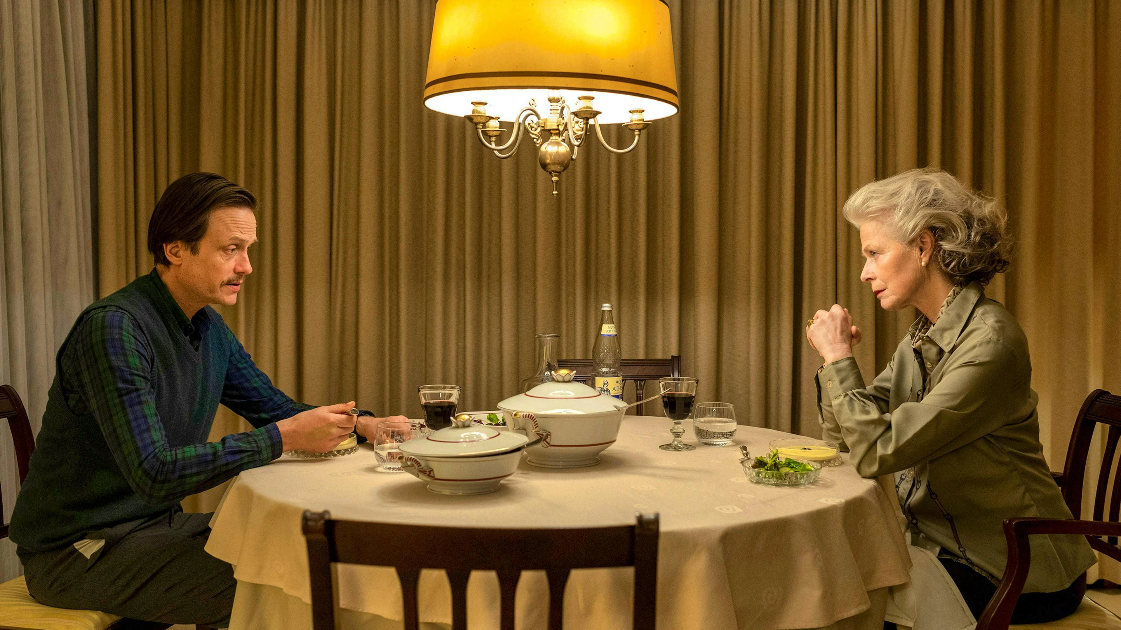 Elenor (Corinna Kirchhoff) and Robert (August Diehl) eat together. It will be the last of many meals together, because Robert kills his mother and cuts her up into many pieces.