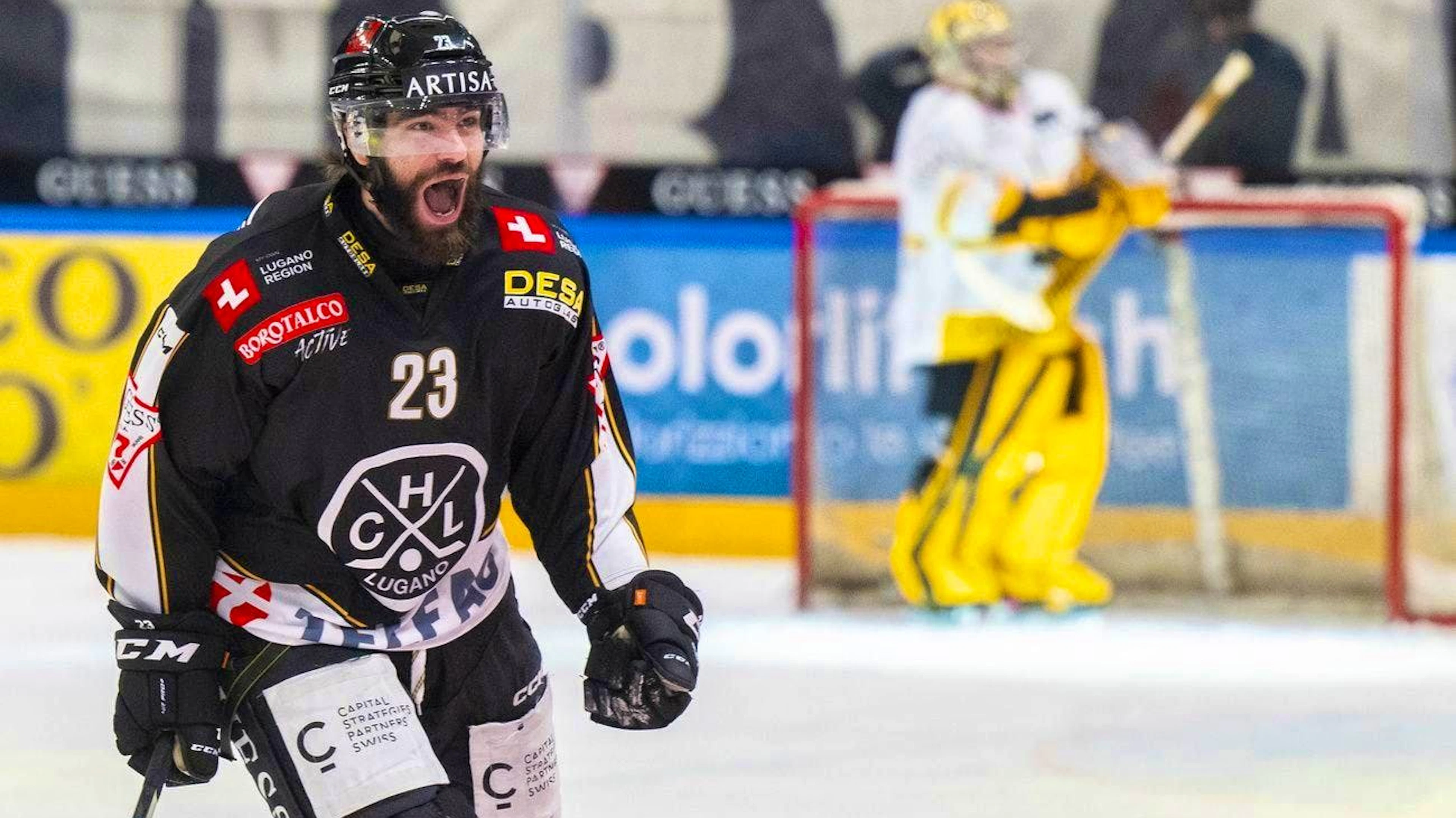 Giovanni Morini and HC Lugano celebrate after the late winning goal in Game 3.