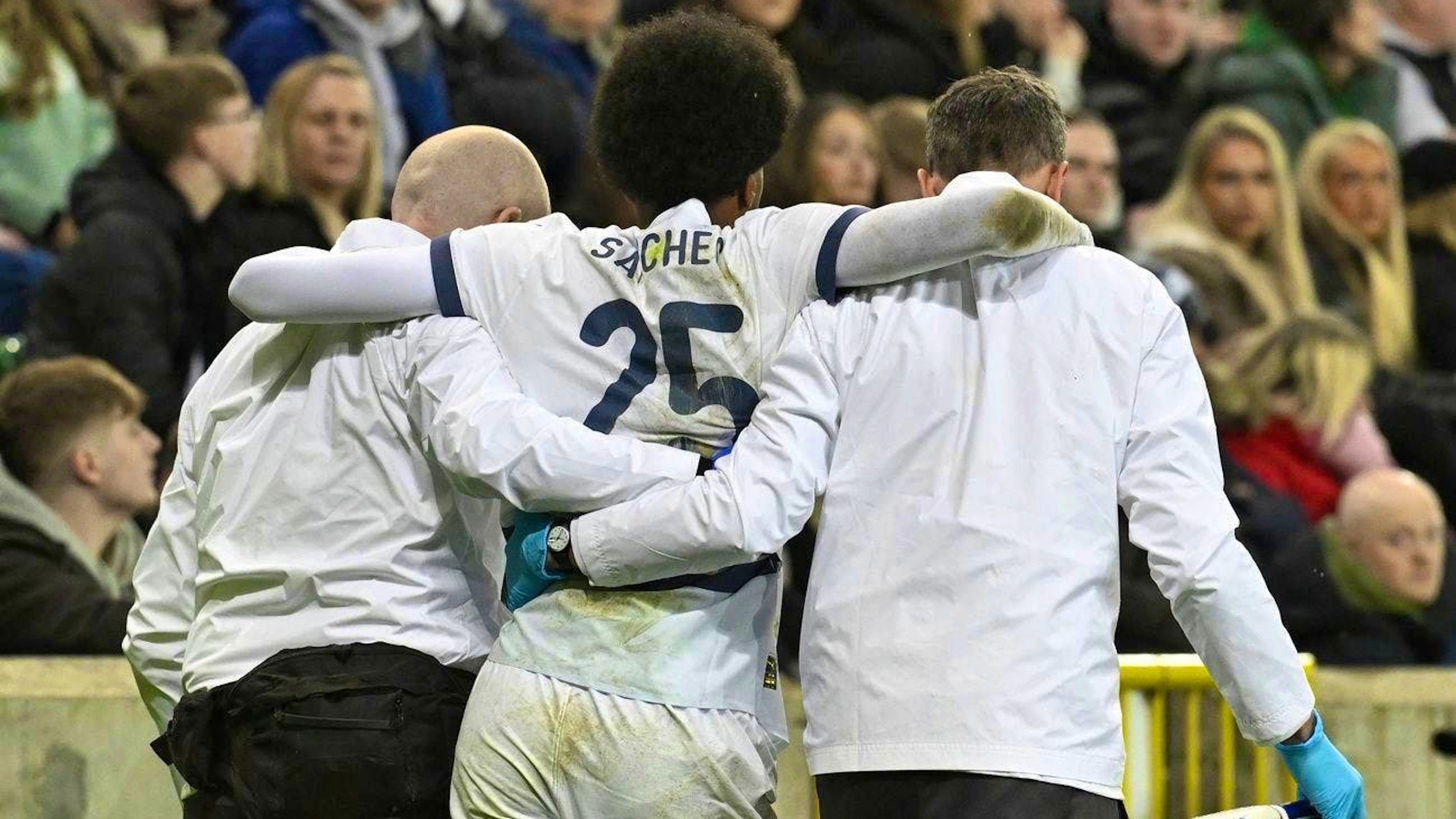 Sanches has to be supported as he leaves the pitch.