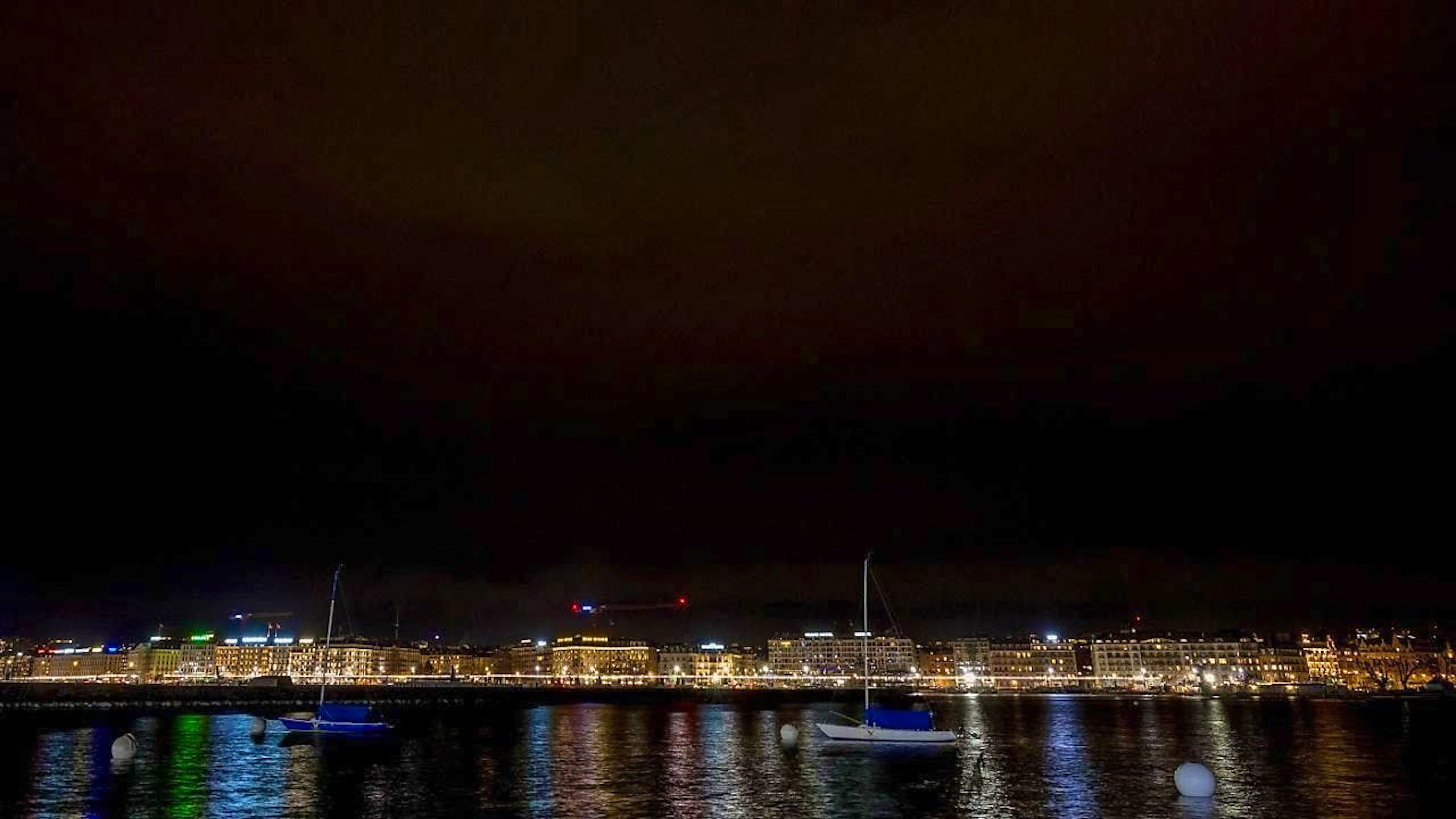 The city of Geneva on Saturday evening during "Earth Hour" without "Jet d'Eau". . .