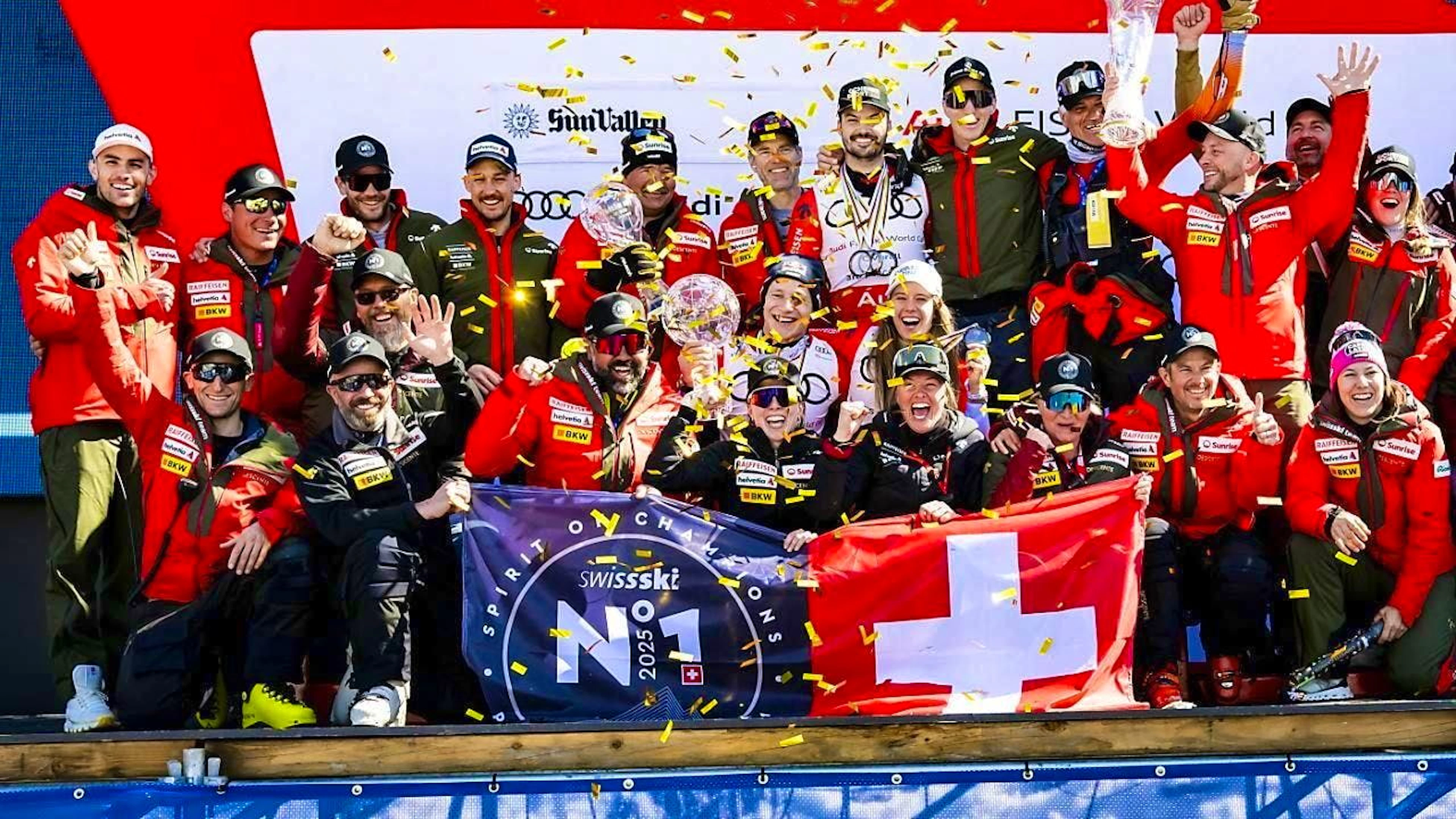 The Swiss team led by Marco Odermatt (in the middle with the big crystal globe) celebrates victory in the Nations Cup