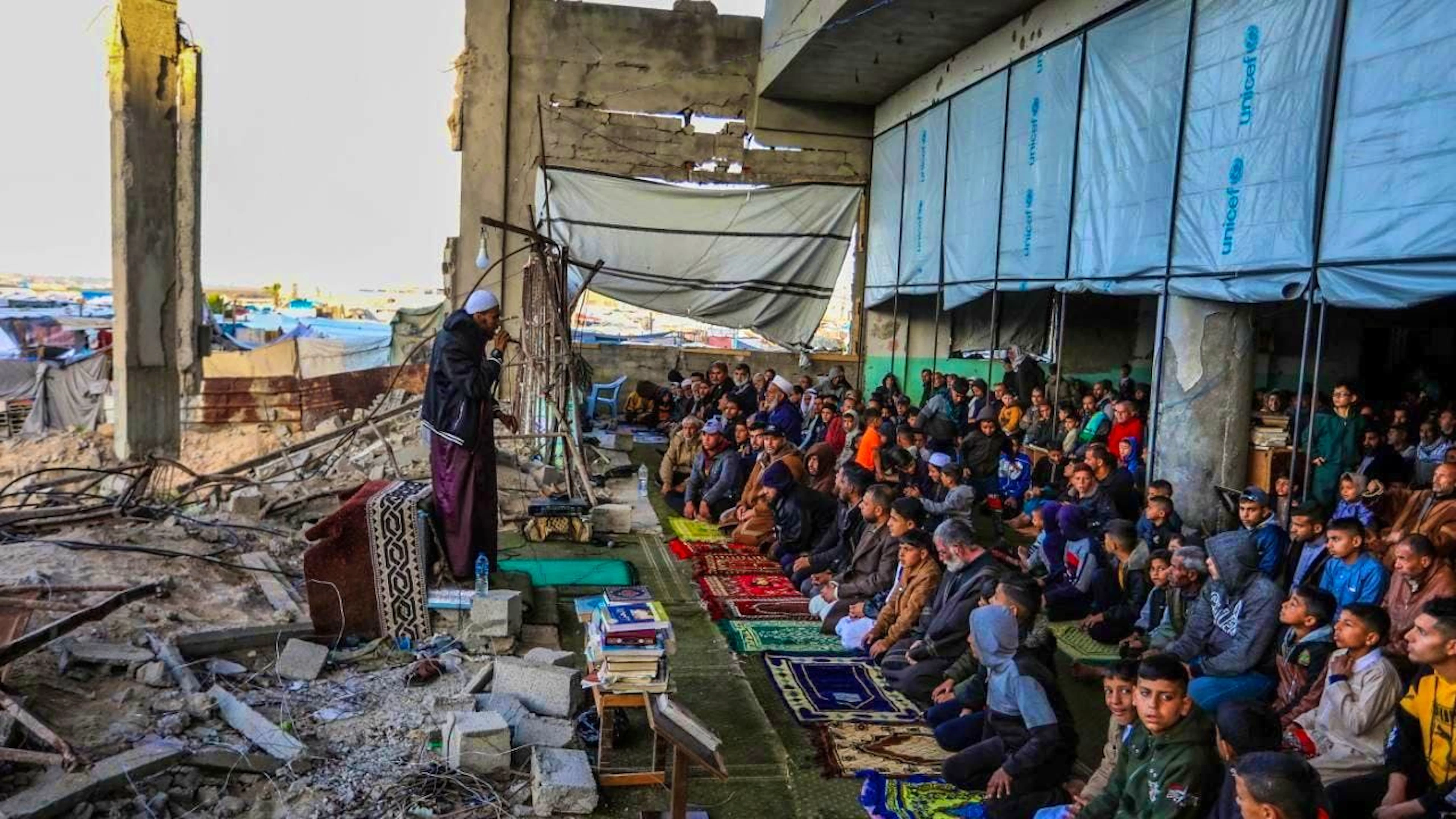 Palestinians perform the Eid prayer in the destroyed Al-Albani Mosque on the first day of Eid al-Fitr, which marks the end of the fasting month of Ramadan. Photo: Abed Rahim Khatib/dpa
