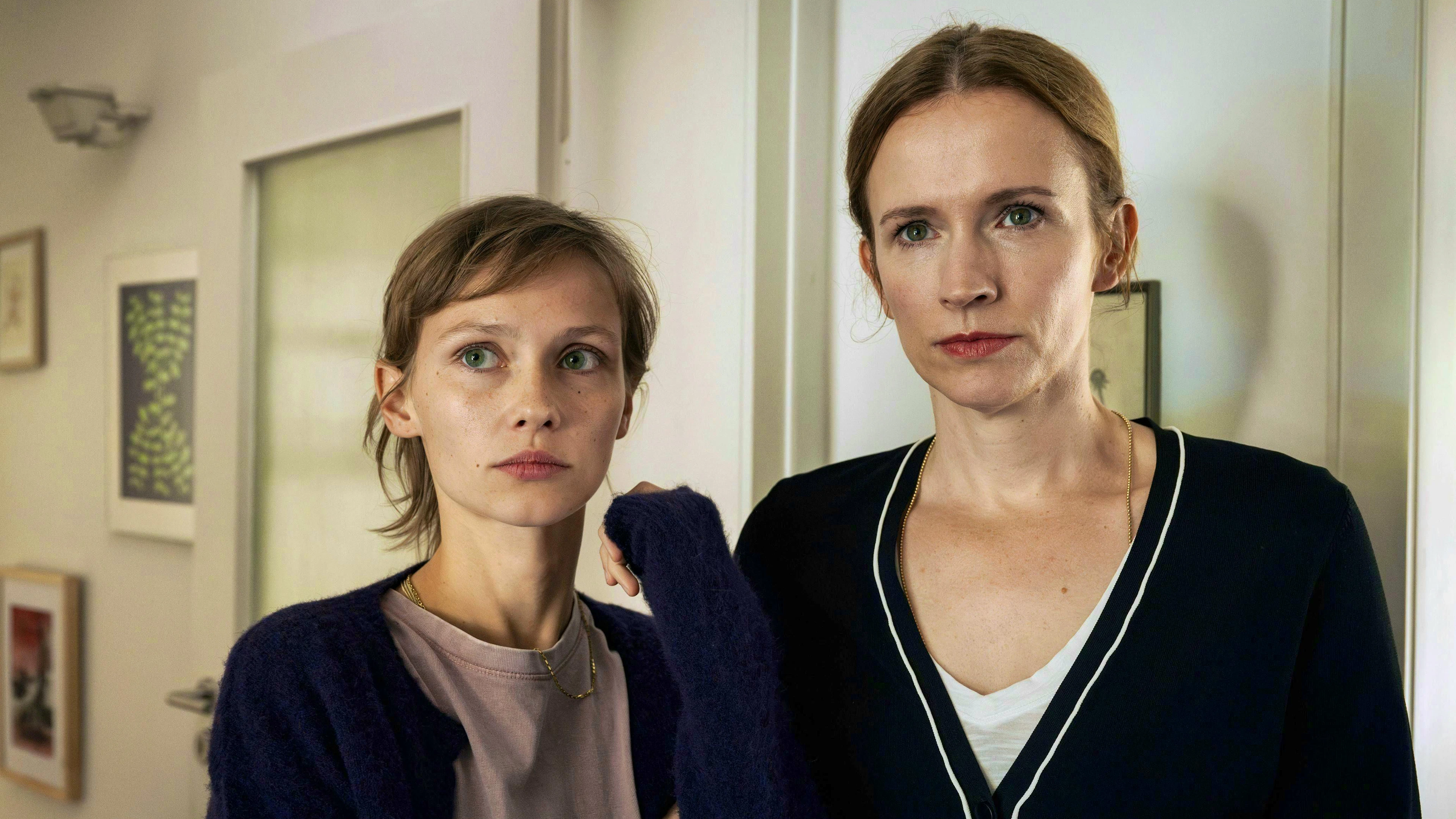 When Fraya Menke (Meira Durand, left) comes under suspicion of murder, her mother Solveig Menke (Adina Vetter) protects her.