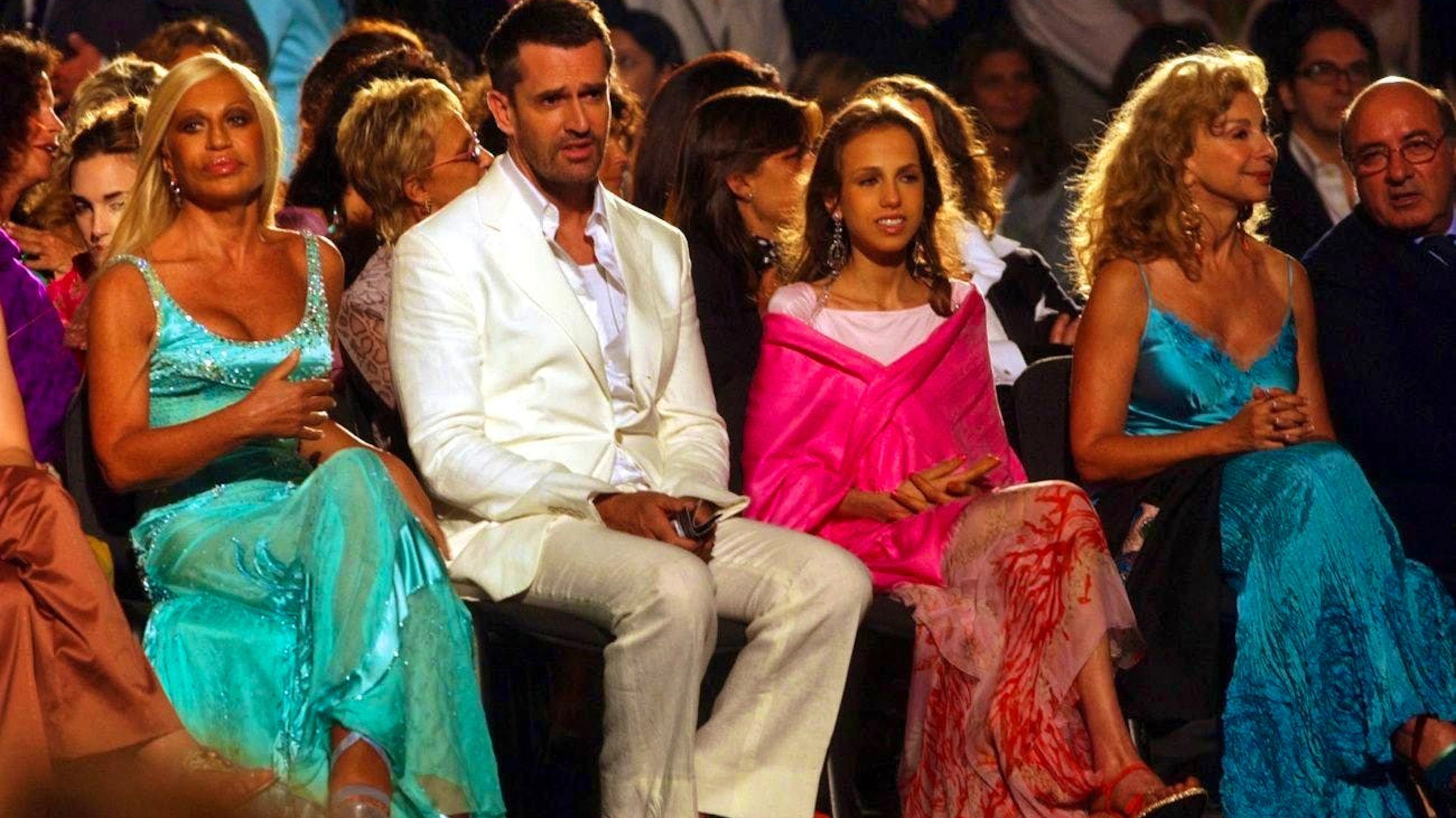 Fashion family: Donatella Versace with US actor Rupert Everett and Allegra, here wearing a pink scarf, at a fashion show in Rome in June 2005.