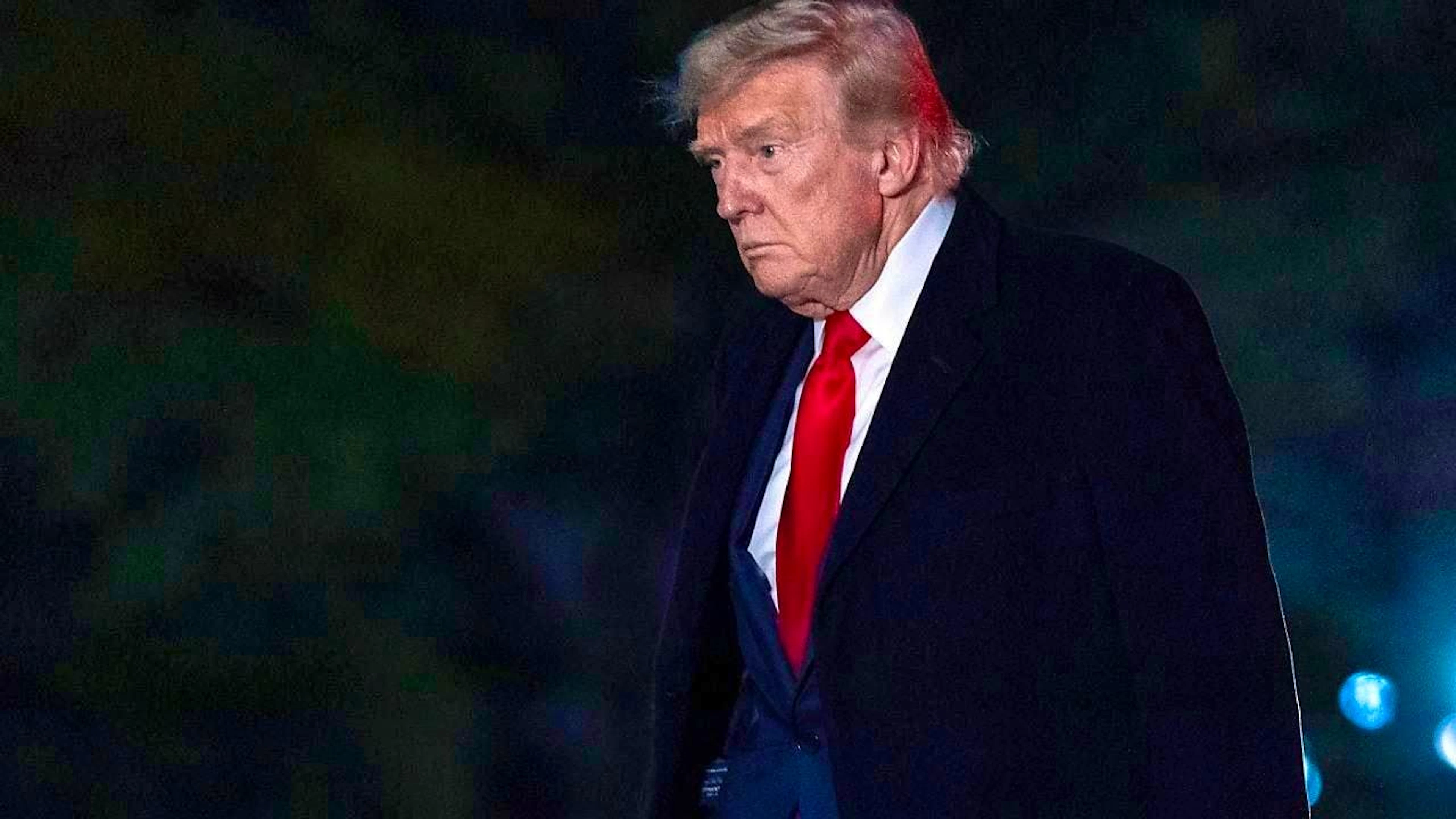 US President Donald Trump walks on the South Lawn of the White House. Photo: Jose Luis Magana/AP/dpa