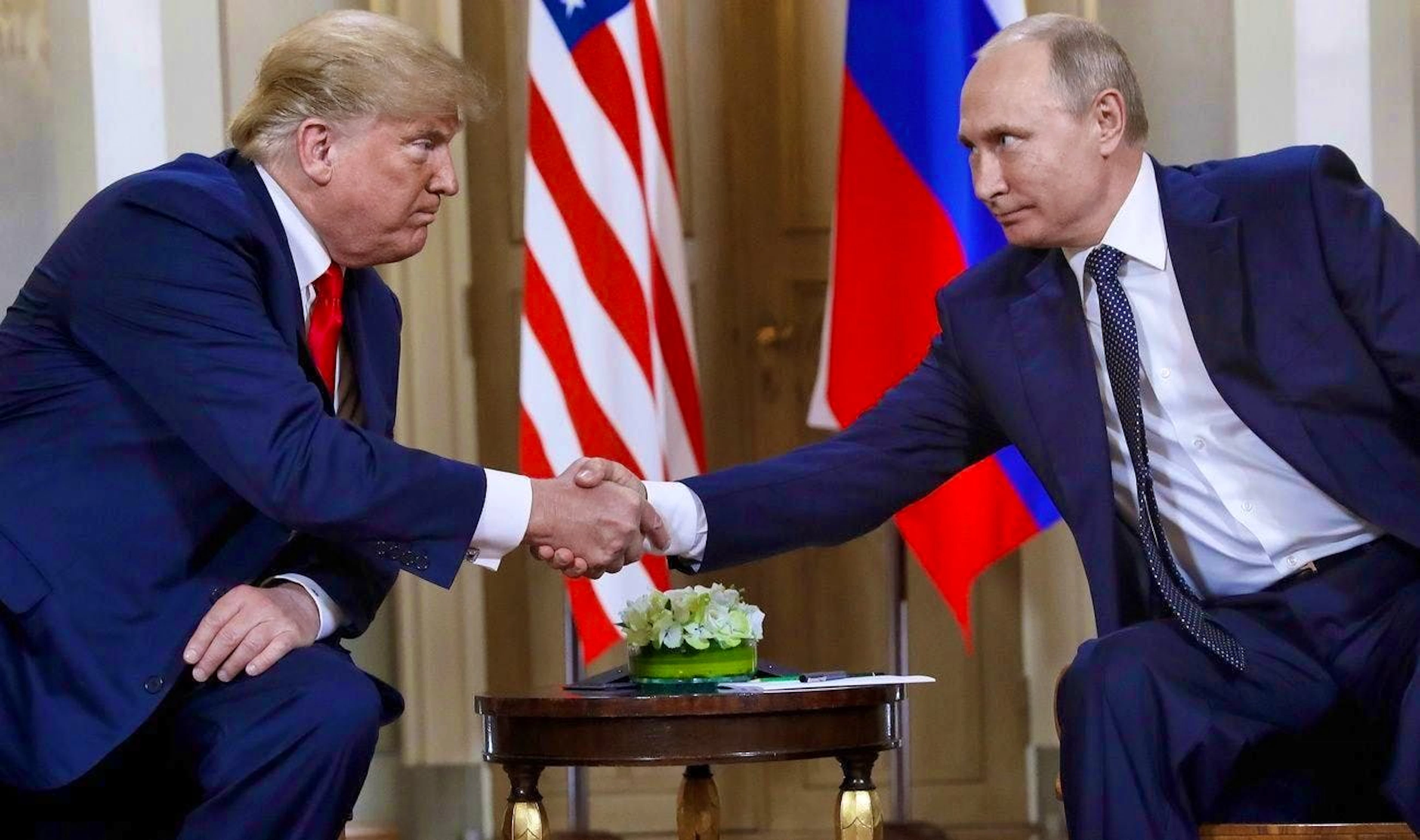 Trump and Putin at an earlier meeting in 2018 - the relationship between the two heads of state is currently tense.