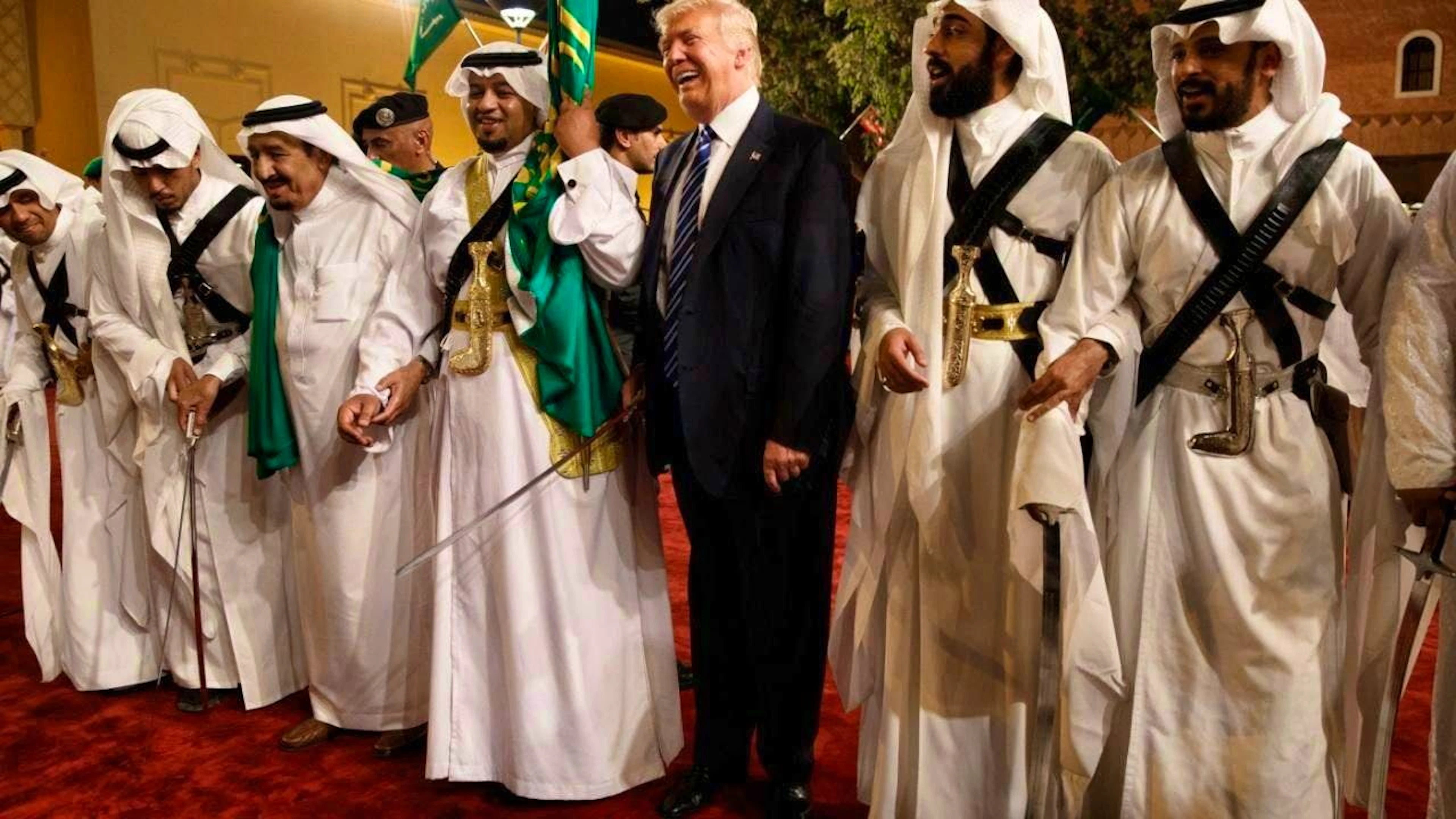 ARCHIVE - US President Donald Trump (M) holds a traditional sword during a welcome ceremony at Murabba Palace in Riyadh, Saudi Arabia, on May 20, 2017. Photo: Evan Vucci/dpa