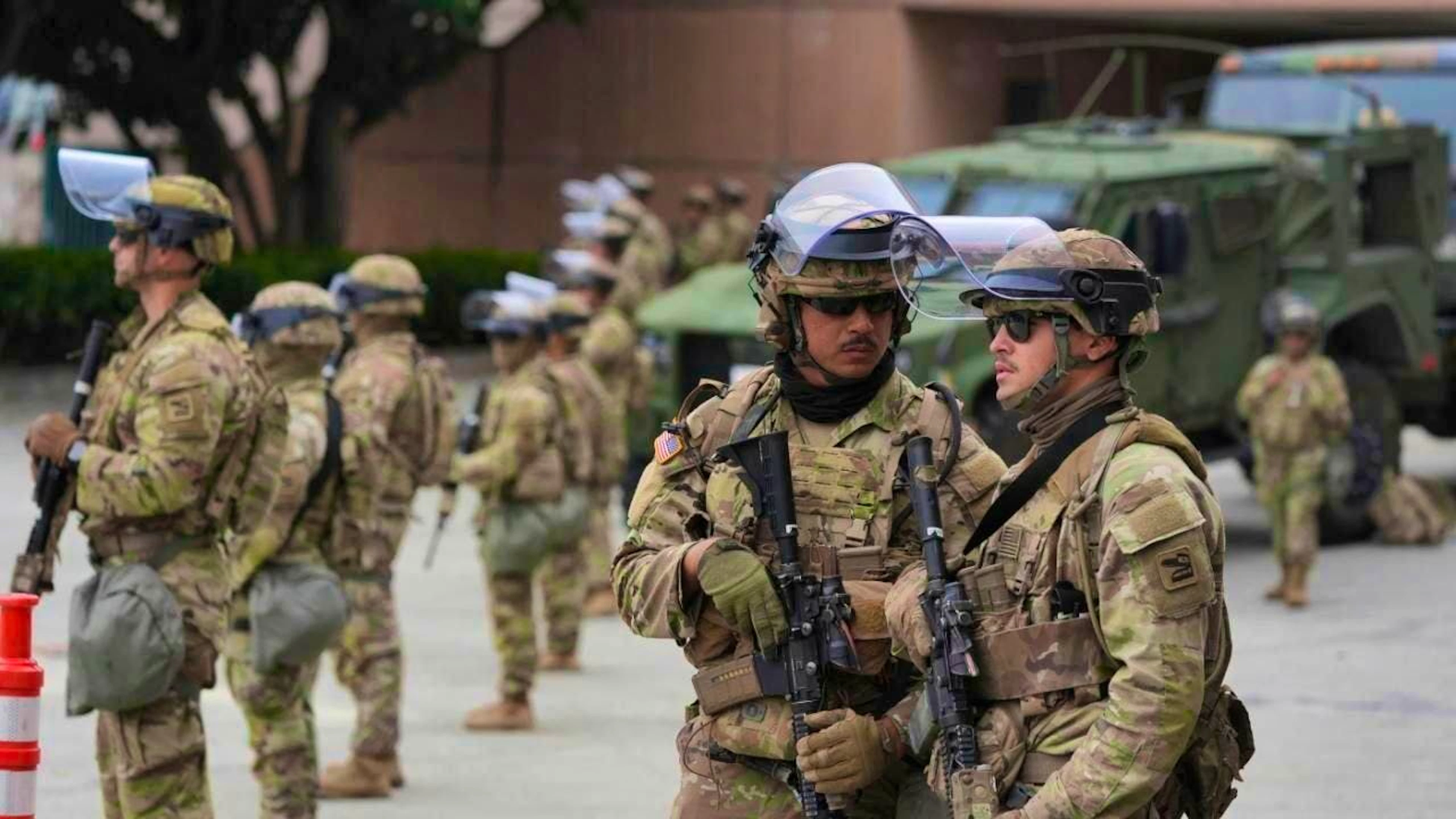 The US National Guard is deployed outside the federal prison in downtown Los Angeles after protests against a raid on immigrants the night before. Photo: Jae Hong/AP/dpa