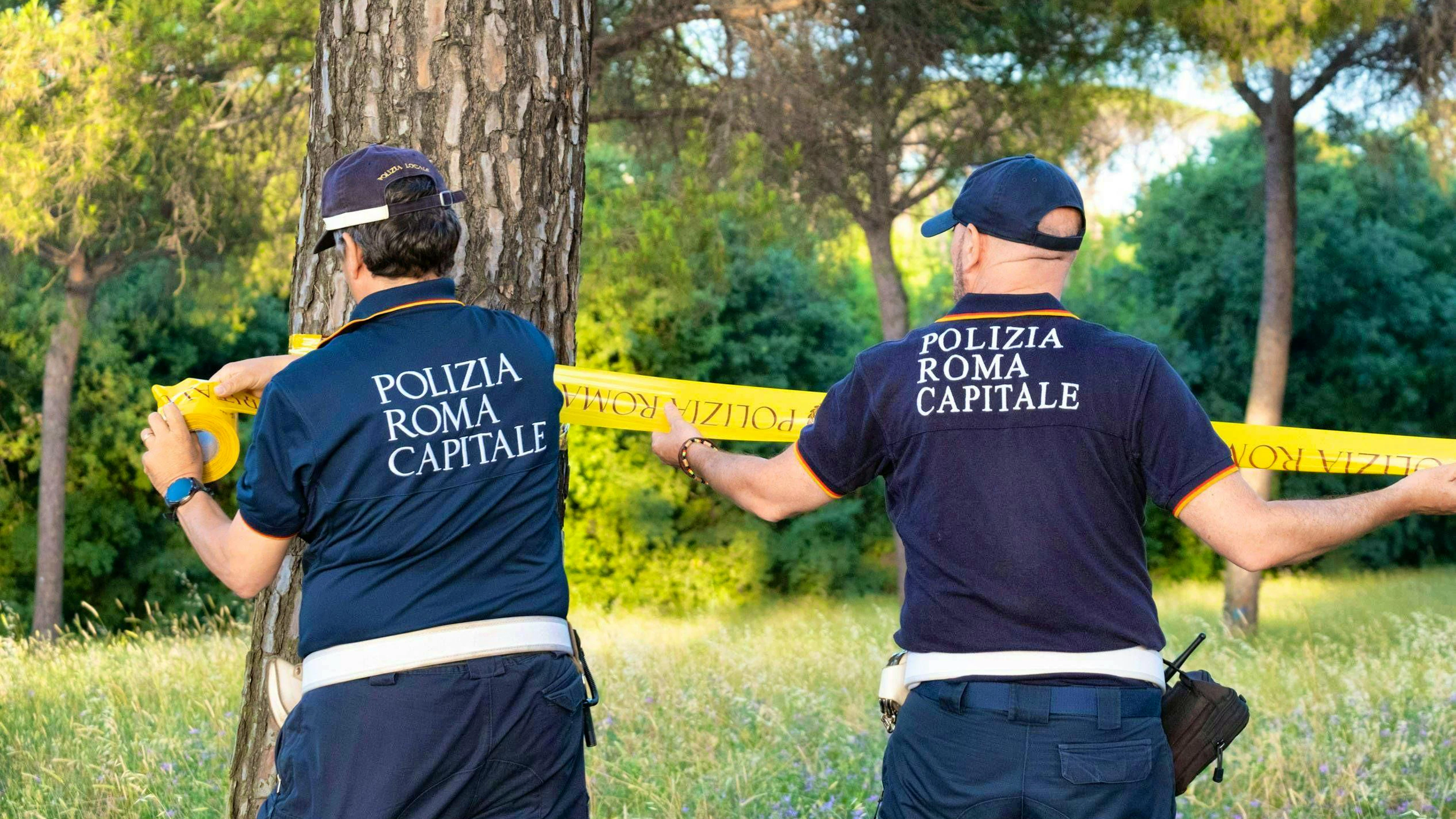 Police cordon off the site where the dead baby was found in Rome's Villa Doria Pamphili city park. Two women had discovered it while playing volleyball.