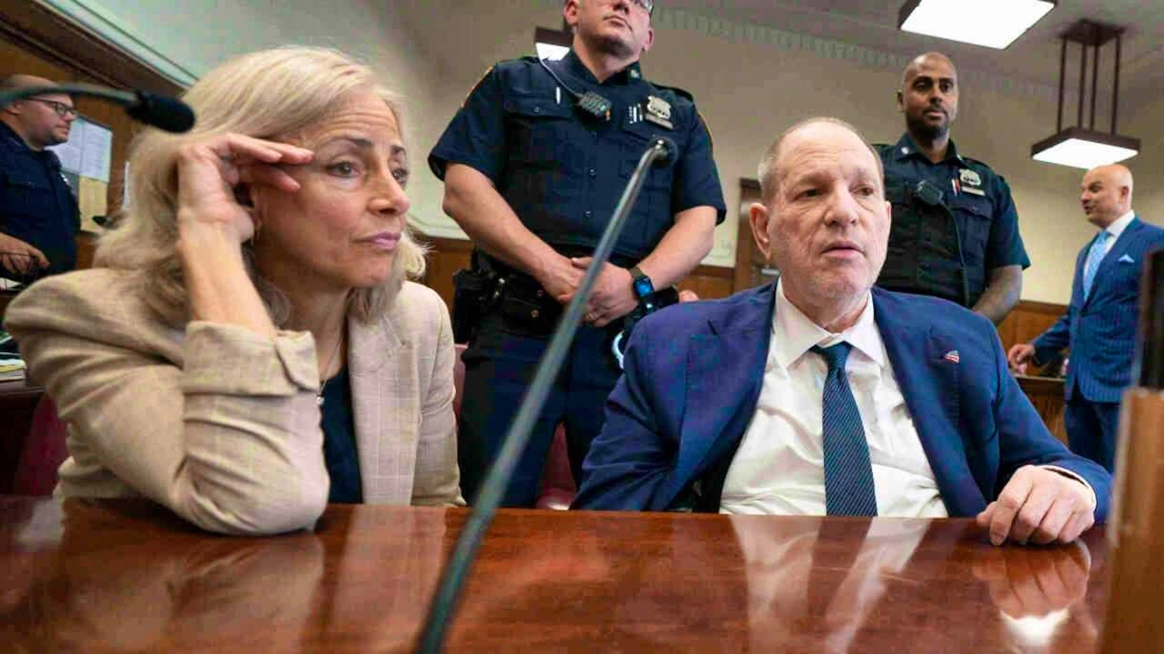 dpatopbilder - Harvey Weinstein (front r), former film producer from the USA, attends his retrial in Manhattan Criminal Court in New York. Former Hollywood producer Harvey Weinstein has been found guilty again in a retrial - but only partially. Photo: Steven Hirsch/Pool New York Post/AP/dpa